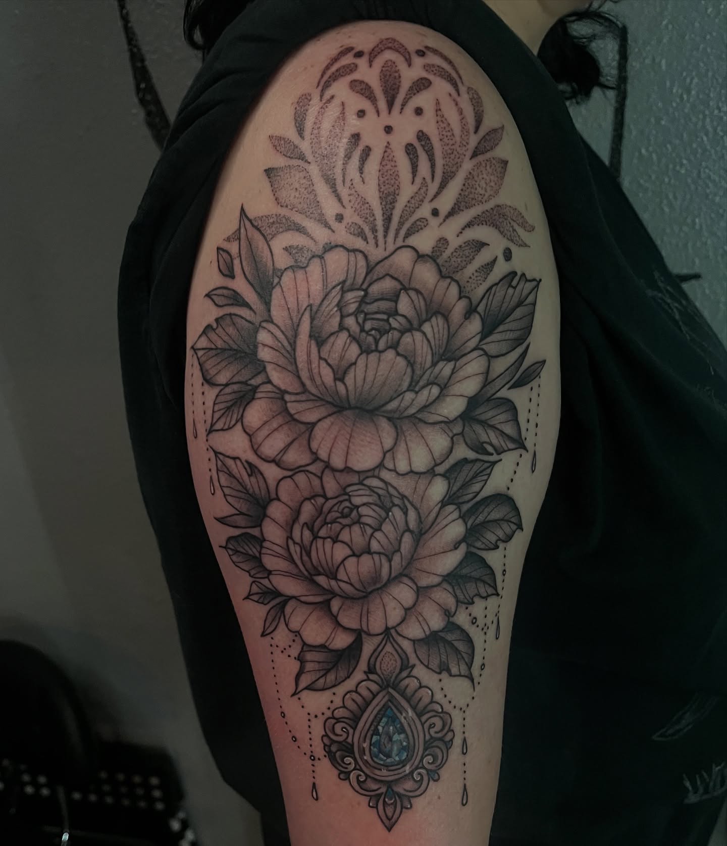Peony flowers dotwork tattoo on the upper arm by Timmy