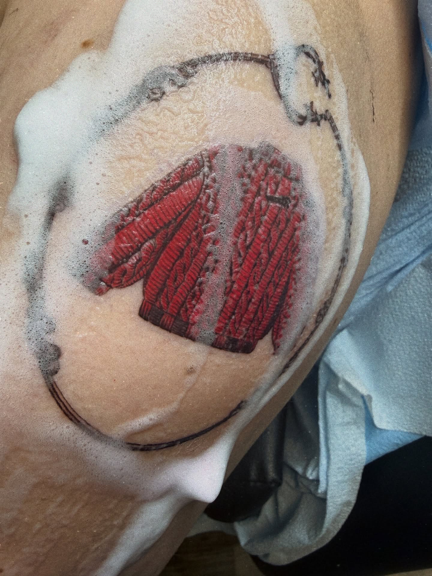 Baseball glove realism tattoo on the upper arm by Melissa Rose Moya