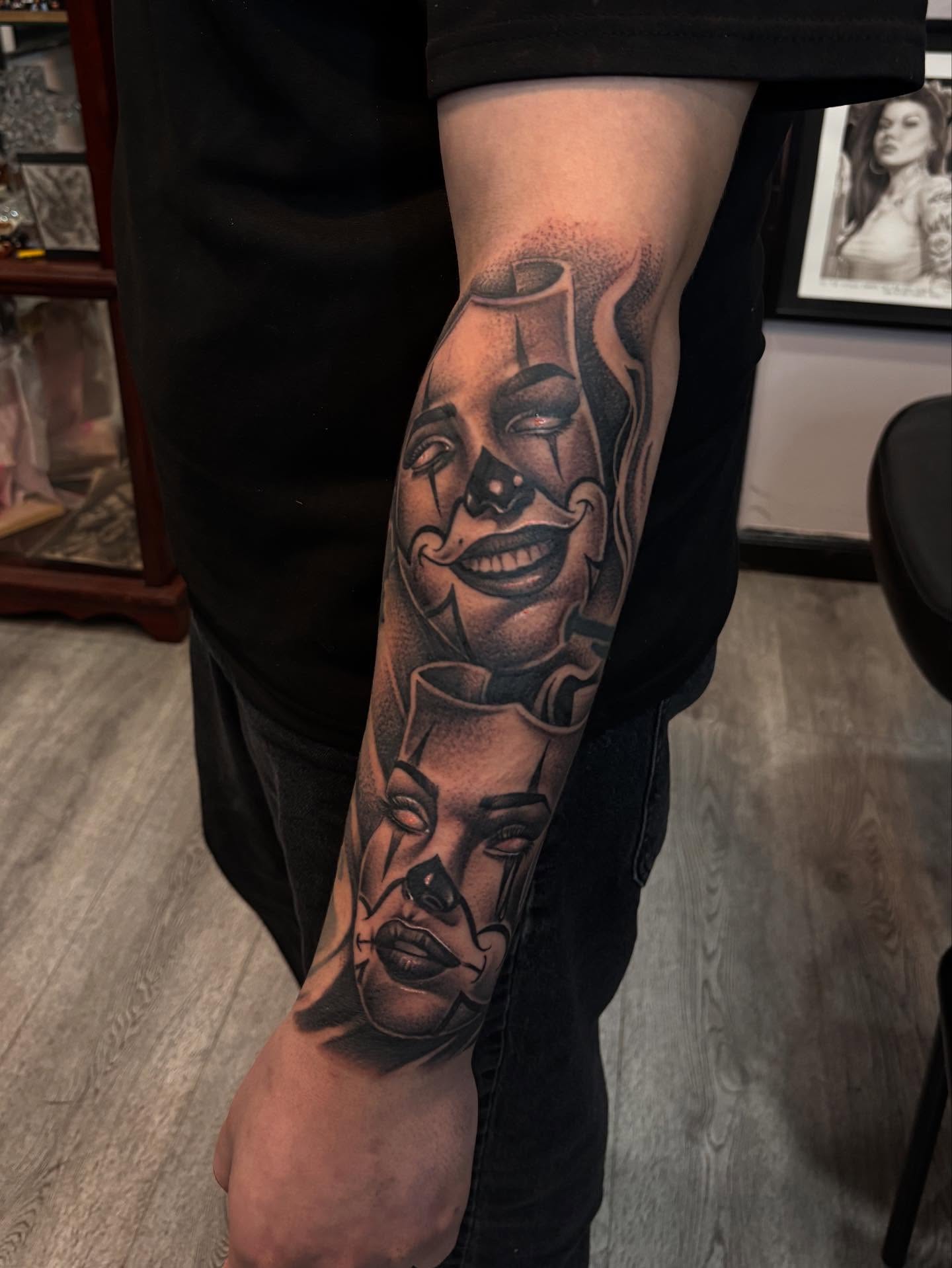 Clown faces dotwork tattoo on the forearm by michael
