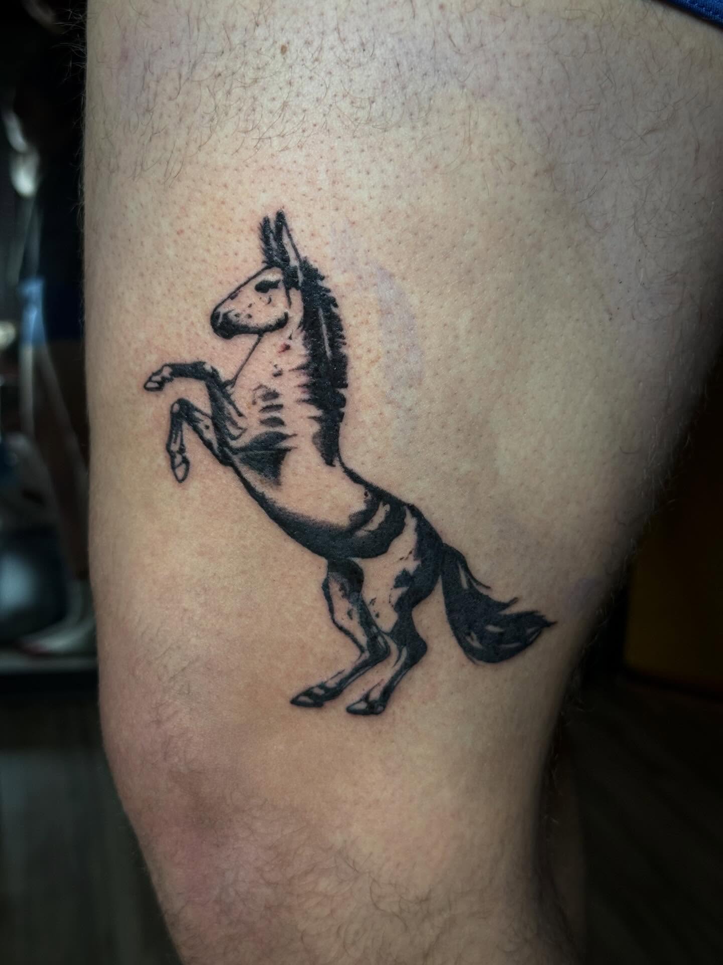 Horse black and grey tattoo on the thigh by Taytum Marsing, Salt Lake City, Utah