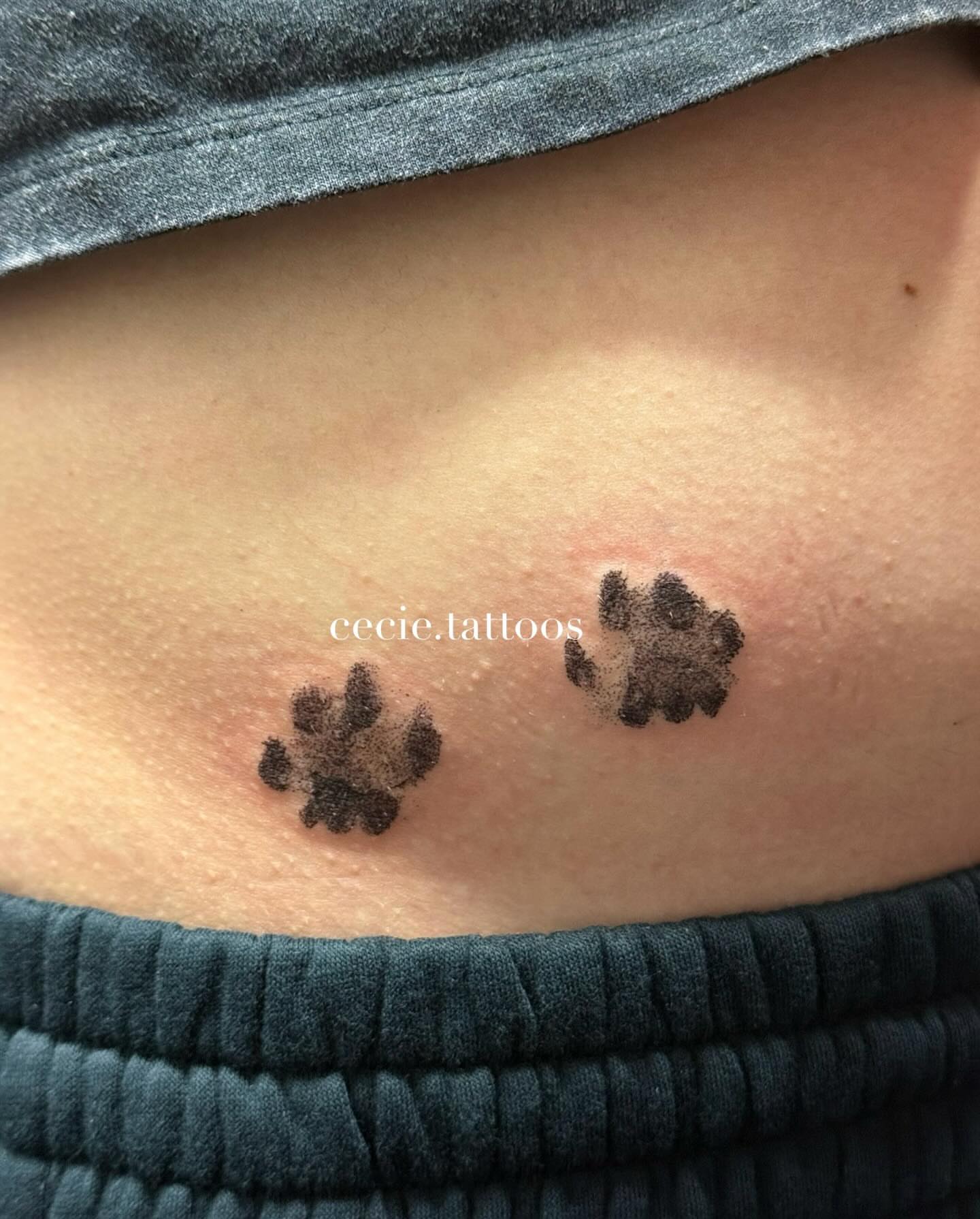Paw prints dotwork tattoo on the ribs by cecie moua