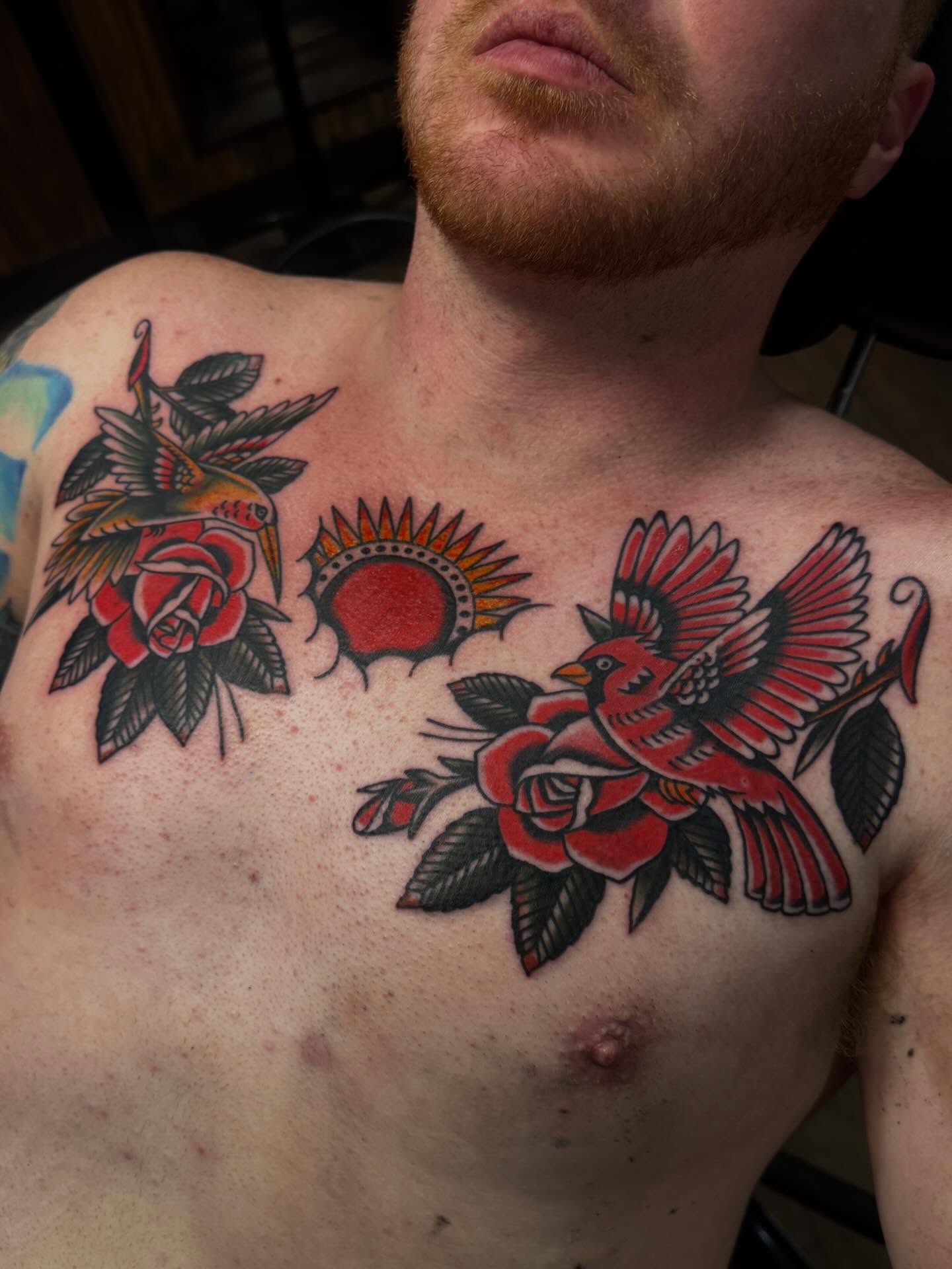 Birds and roses American traditional tattoo on the chest by Ryan Engels