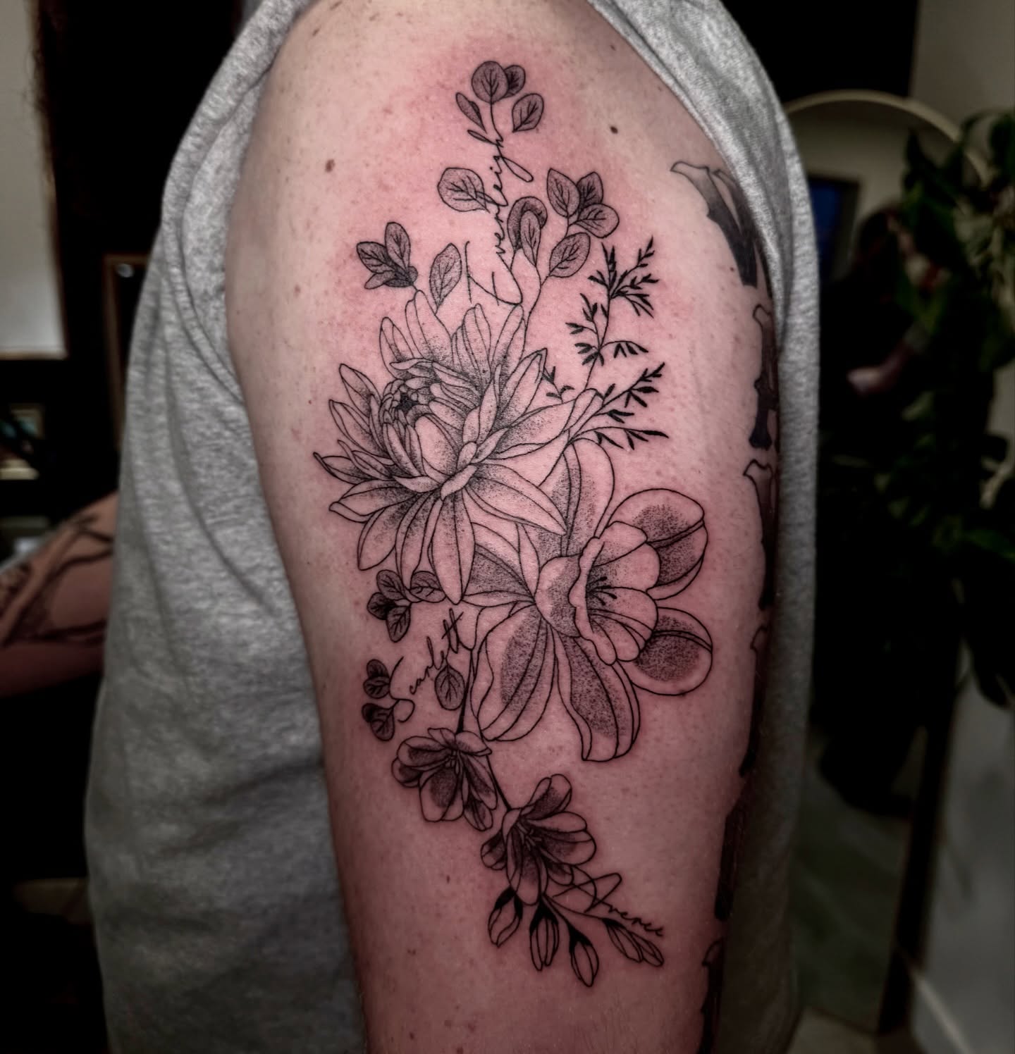 Floral arrangement black and grey tattoo on the upper arm by Ki ☆ SLC TATTOO ARTIST