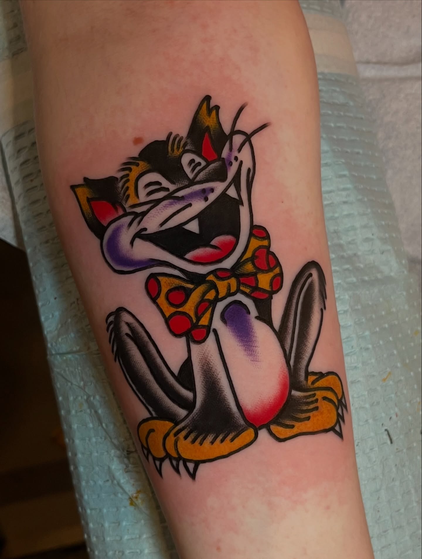 Tom cat American traditional tattoo on the forearm by Anthony Tattooer, Seattle, Washington