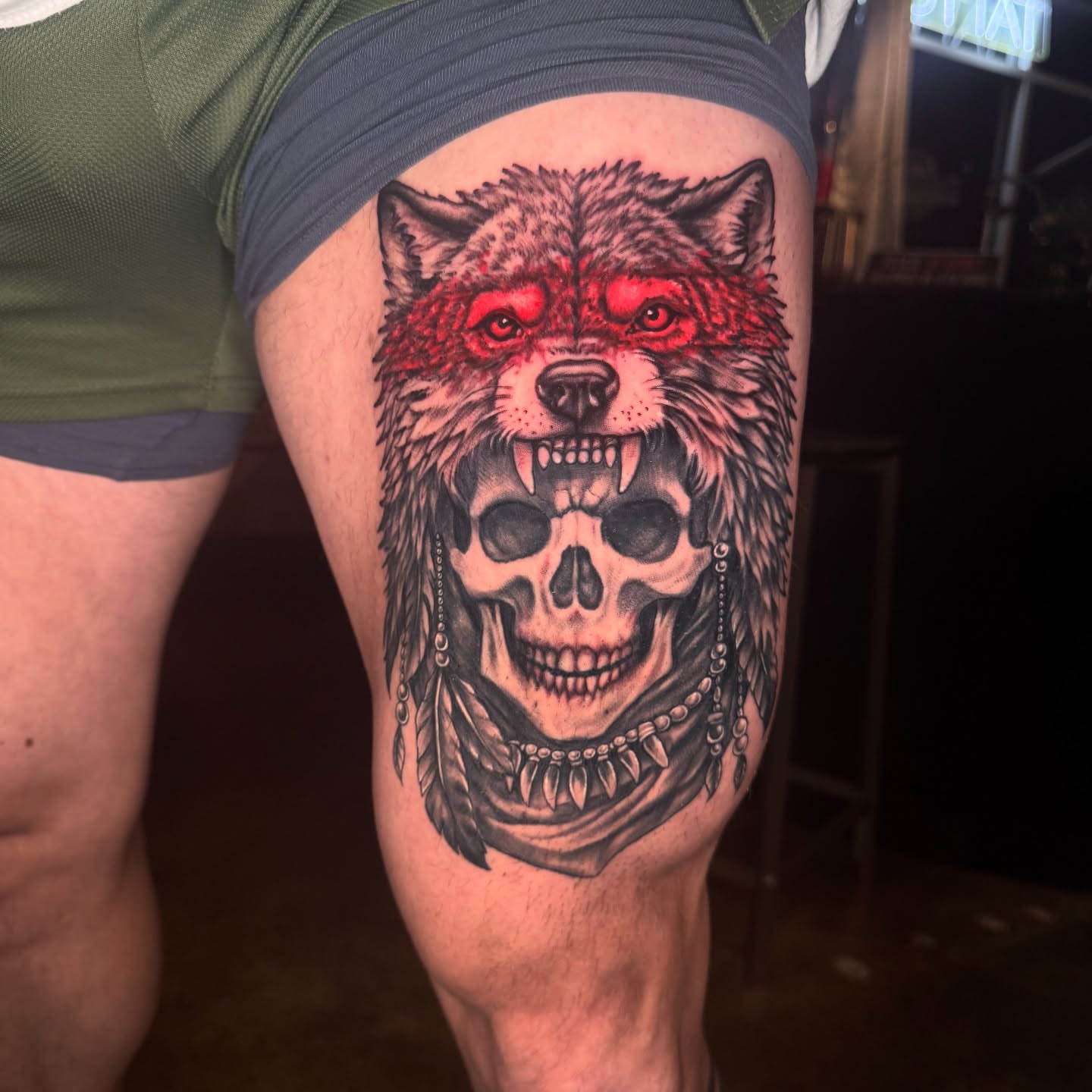 Wolf skull dark realism tattoo on the thigh by Sideshow Danny