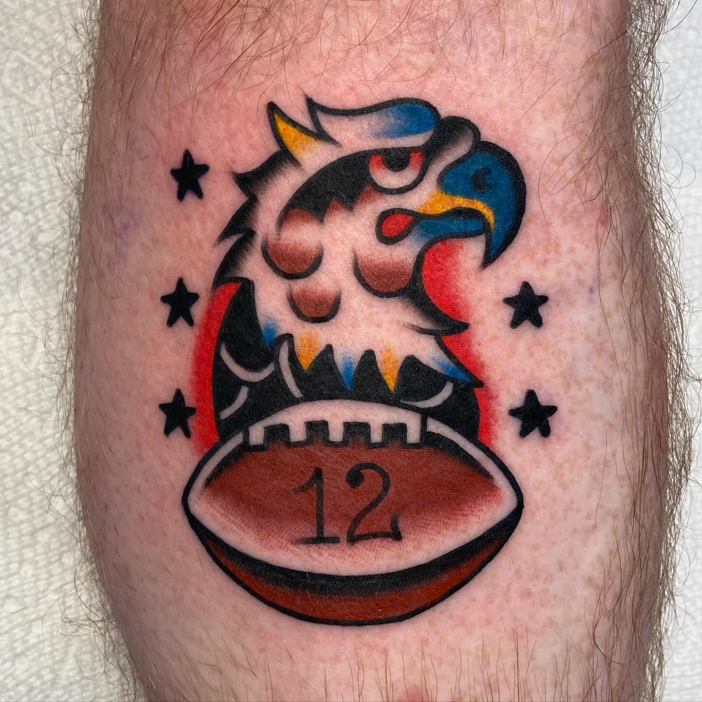 Football and eagle American traditional tattoo on the forearm by Anthony Jaeger, Seattle, Washington