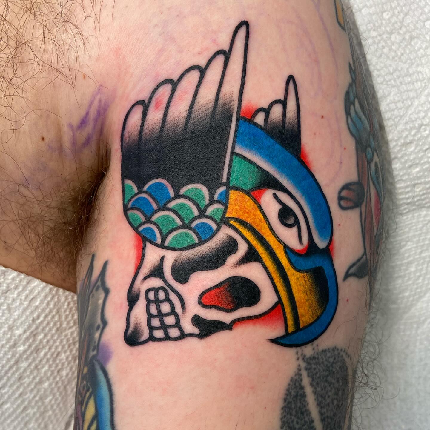 Skull with helmet American traditional tattoo on the forearm by Anthony Jaeger, Seattle, Washington