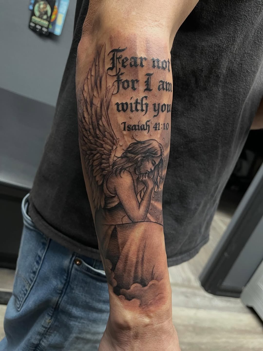 Angel with scripture realism tattoo on the forearm by Chris Torres