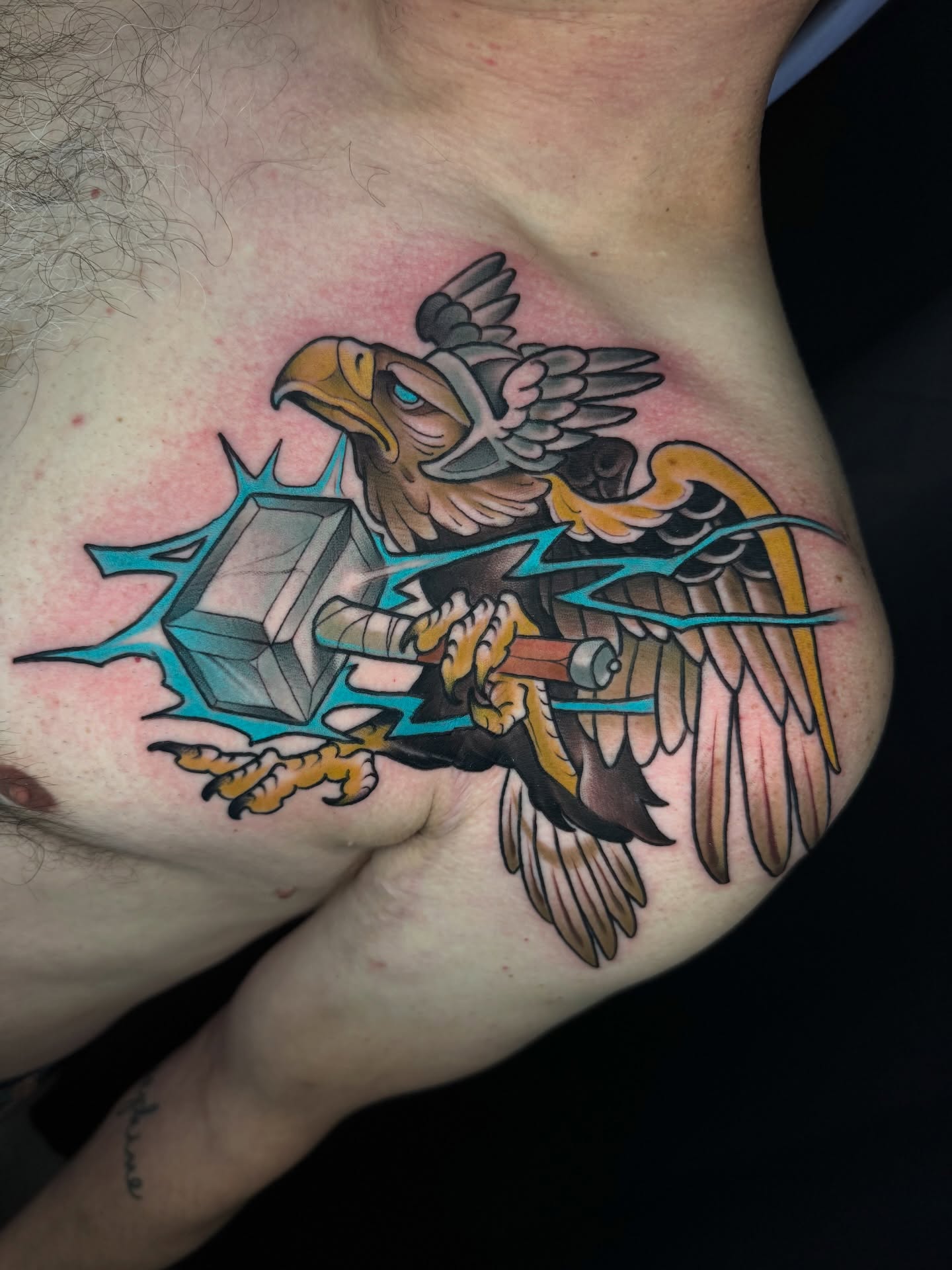 Eagle holding hammer American traditional tattoo on the chest by Freddie Brown, Lombard, IL