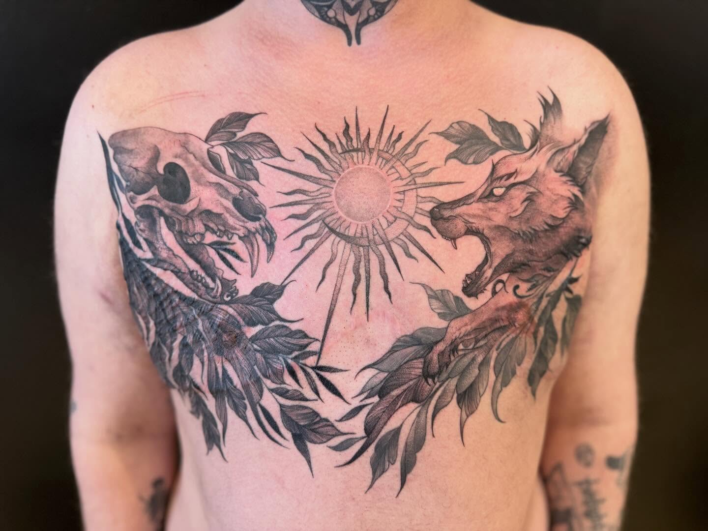 Sun and wolves realism tattoo on the back by Dre