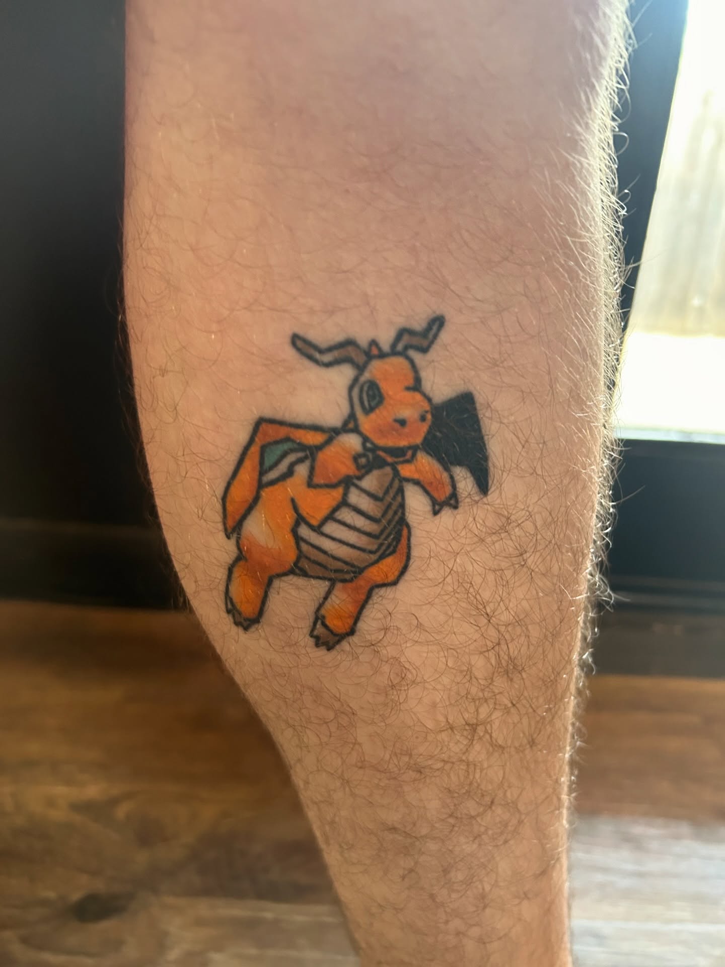 Charizard dotwork tattoo on the thigh by Ollie