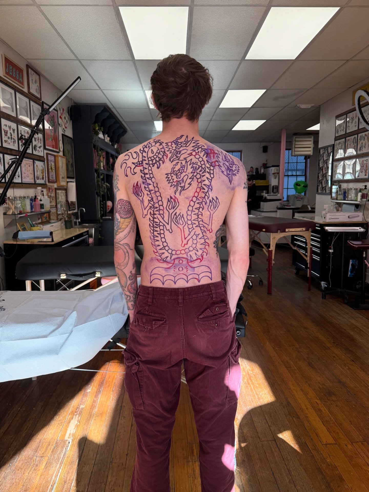 Dragon American traditional tattoo on the back by Roman