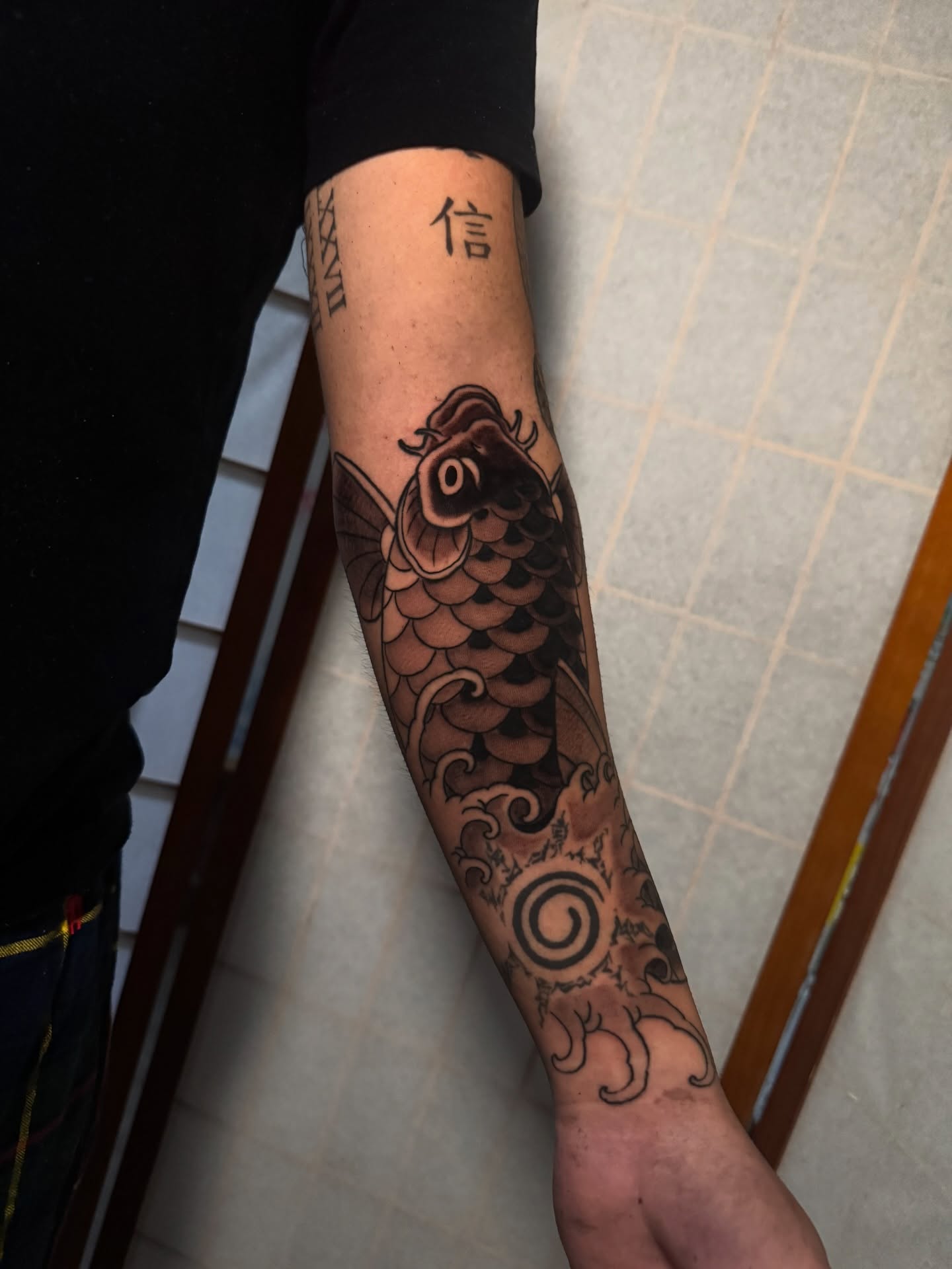 Koi fish japanese irezumi tattoo on the forearm by Dylan