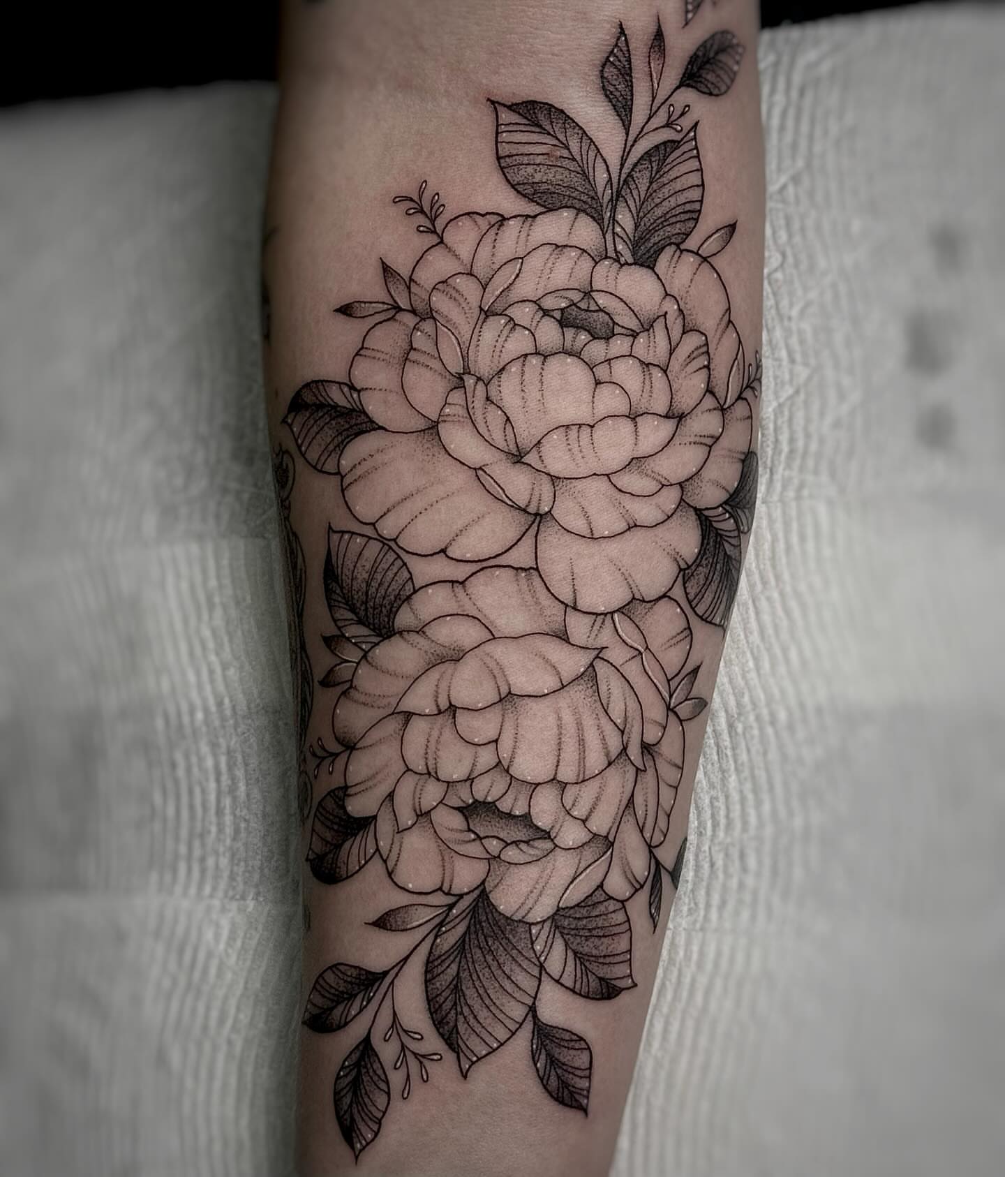 Peony flowers black and grey tattoo on the forearm by 𓍊𓋼 Joana Diane Tattoos 𓋼𓍊