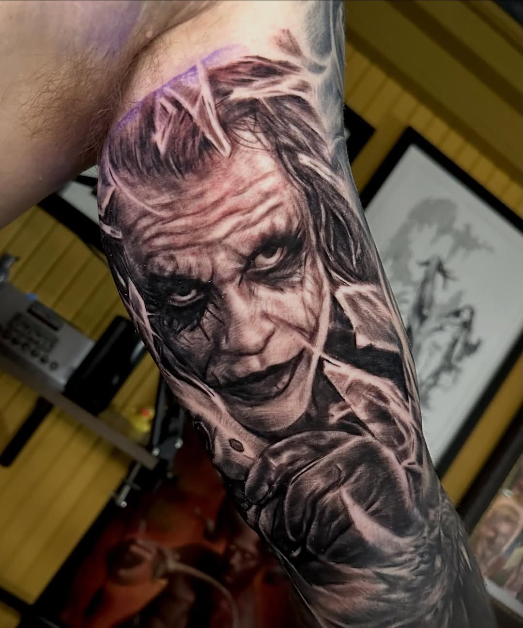 The Joker portrait realism tattoo on the forearm by Comfy Chris Fettig