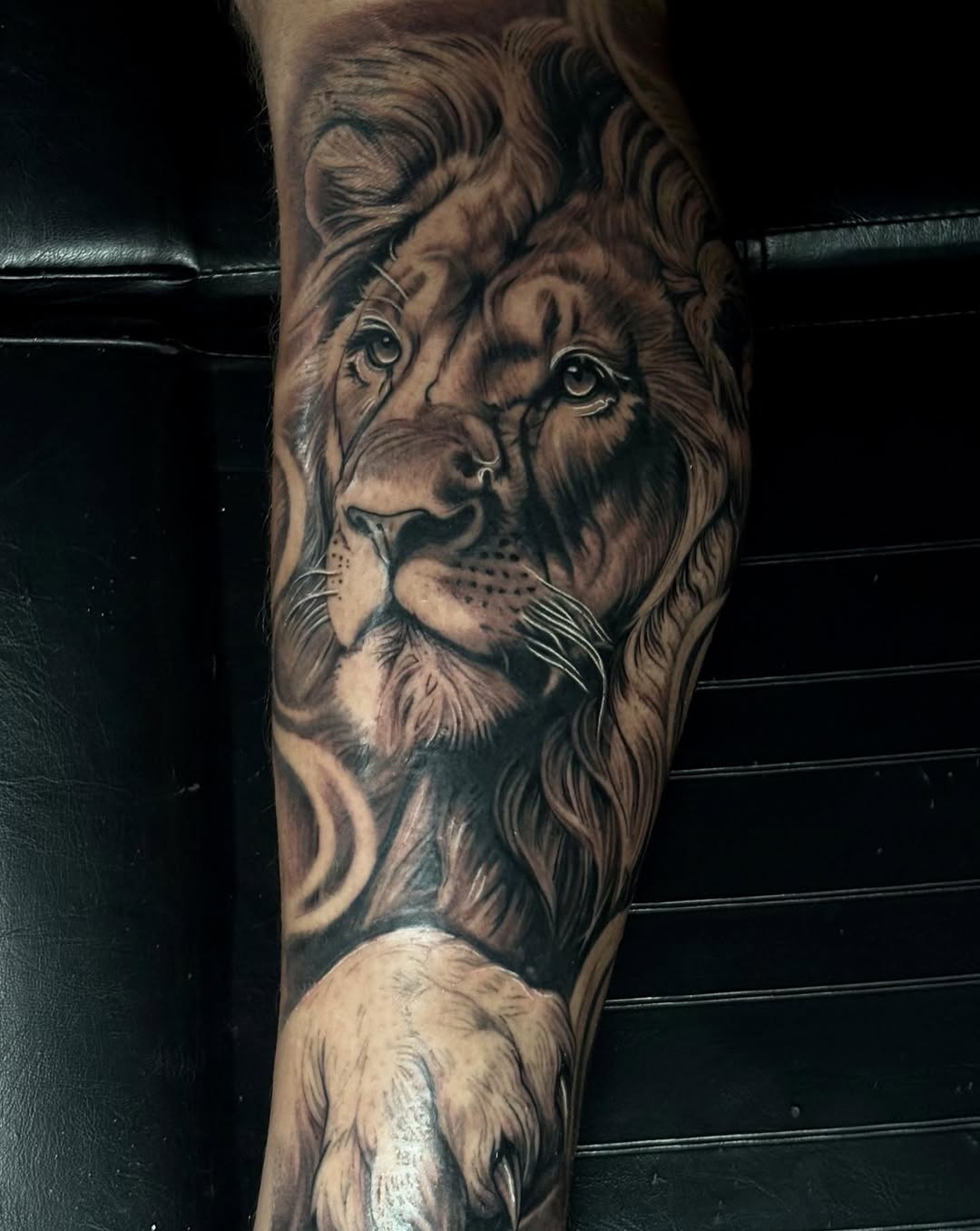 Lion portrait Chicano tattoo on the forearm by Jayden A