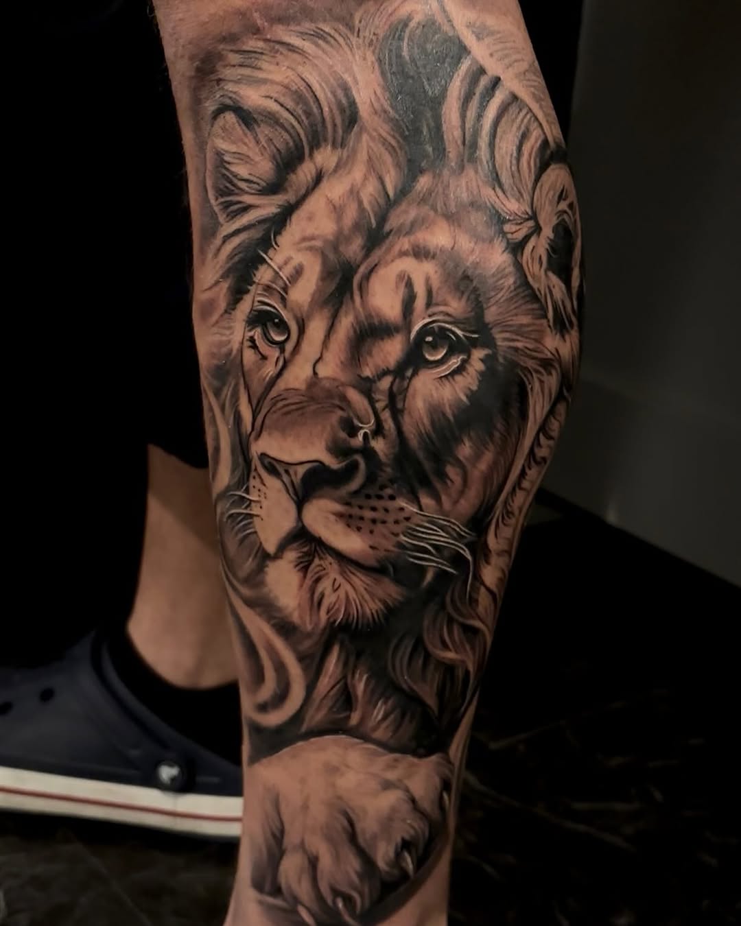 Lion portrait surrealism tattoo on the forearm by Jayden A