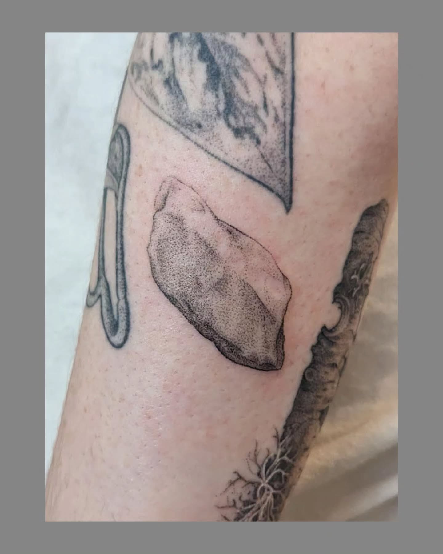 Rock dotwork tattoo on the forearm by Marria