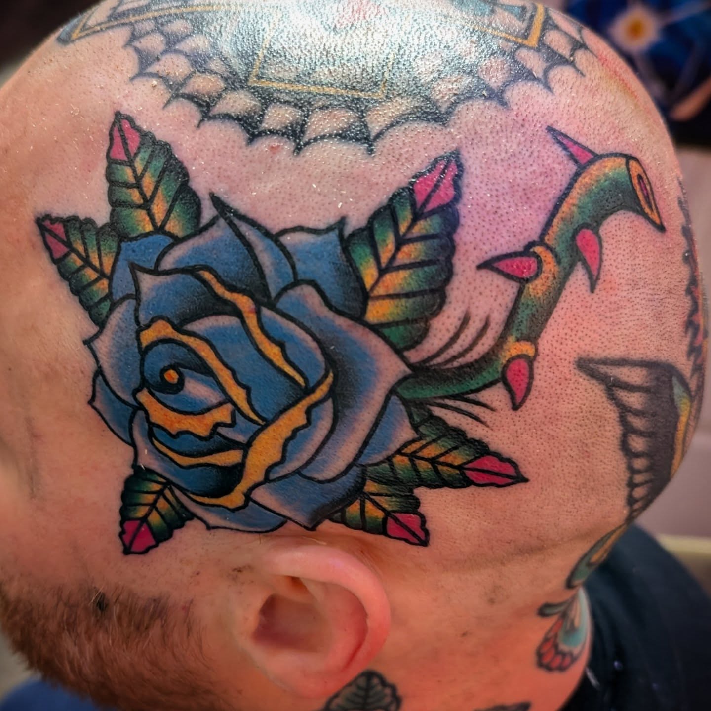 Blue rose with dragon American traditional tattoo on the head by Ryan Slegel