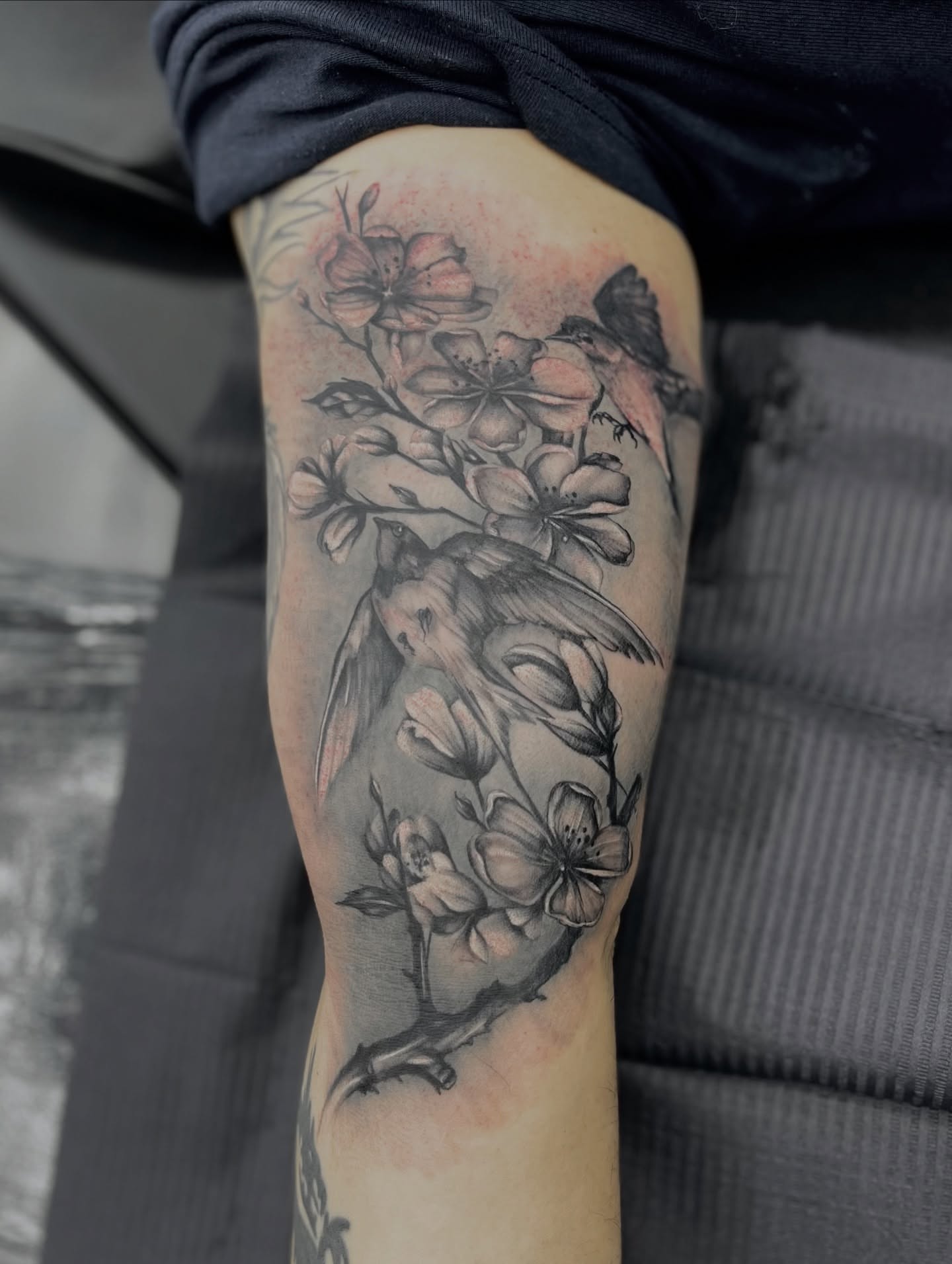 Bird and blossoms realism tattoo on the forearm by Georgianna Ink, Las Vegas, Nevada