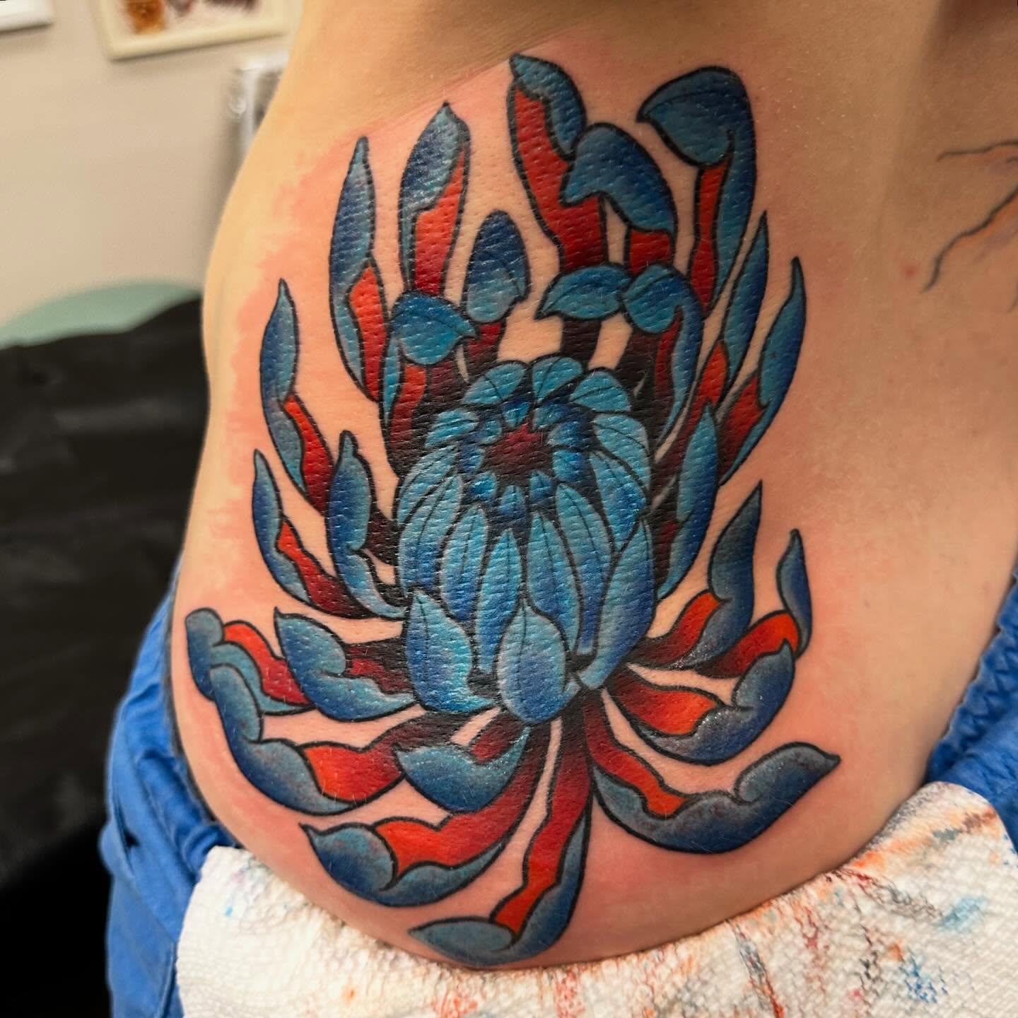 Floral design American traditional tattoo on the ribs by Katie Beth