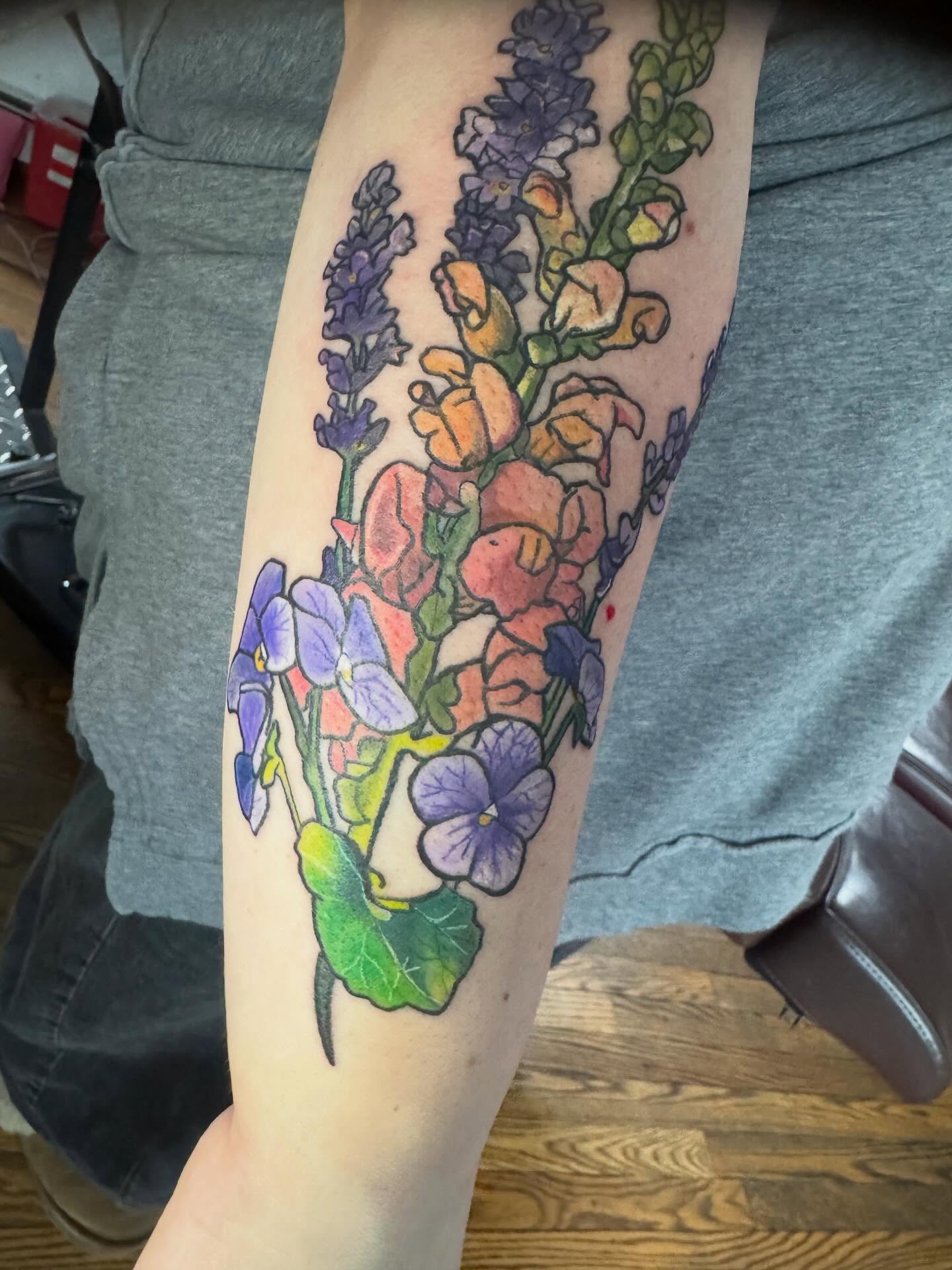 Flower bouquet watercolor tattoo on the forearm by Paula.p.tattoos