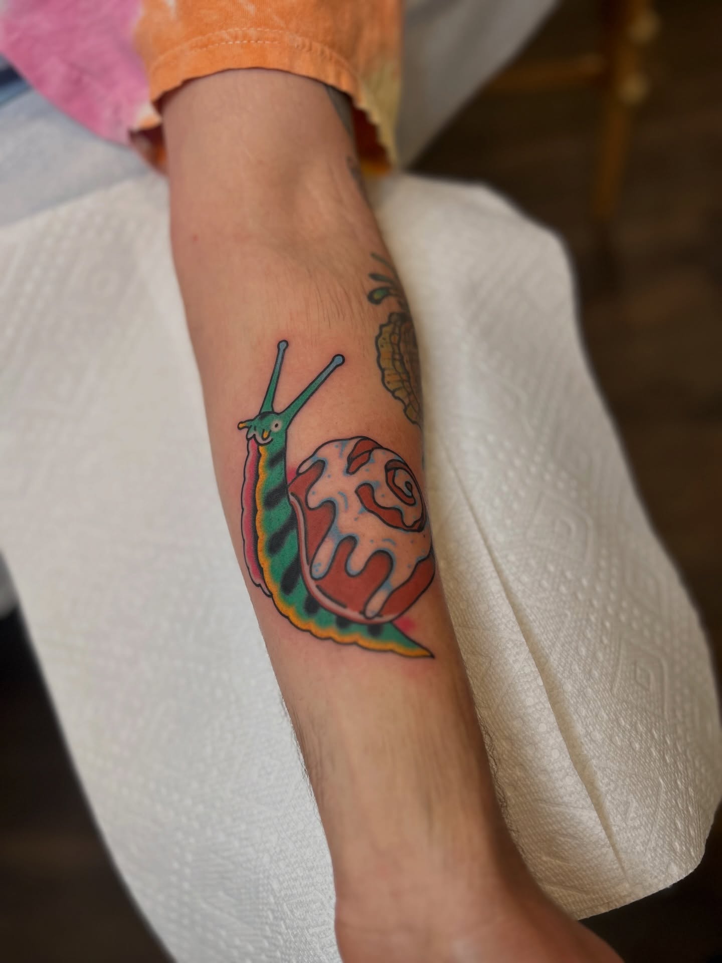Snail new school tattoo on the forearm by Lauren Alexandra