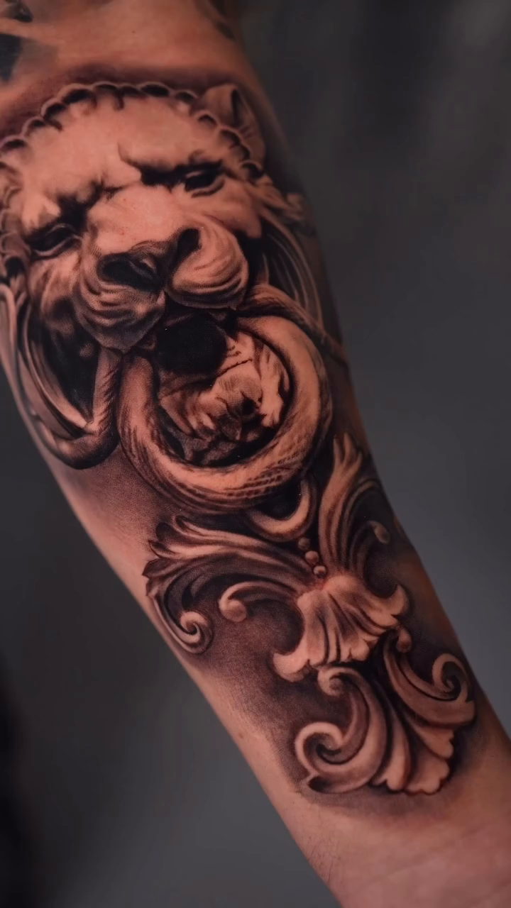 Lion head door knocker realism tattoo by Giona Starace