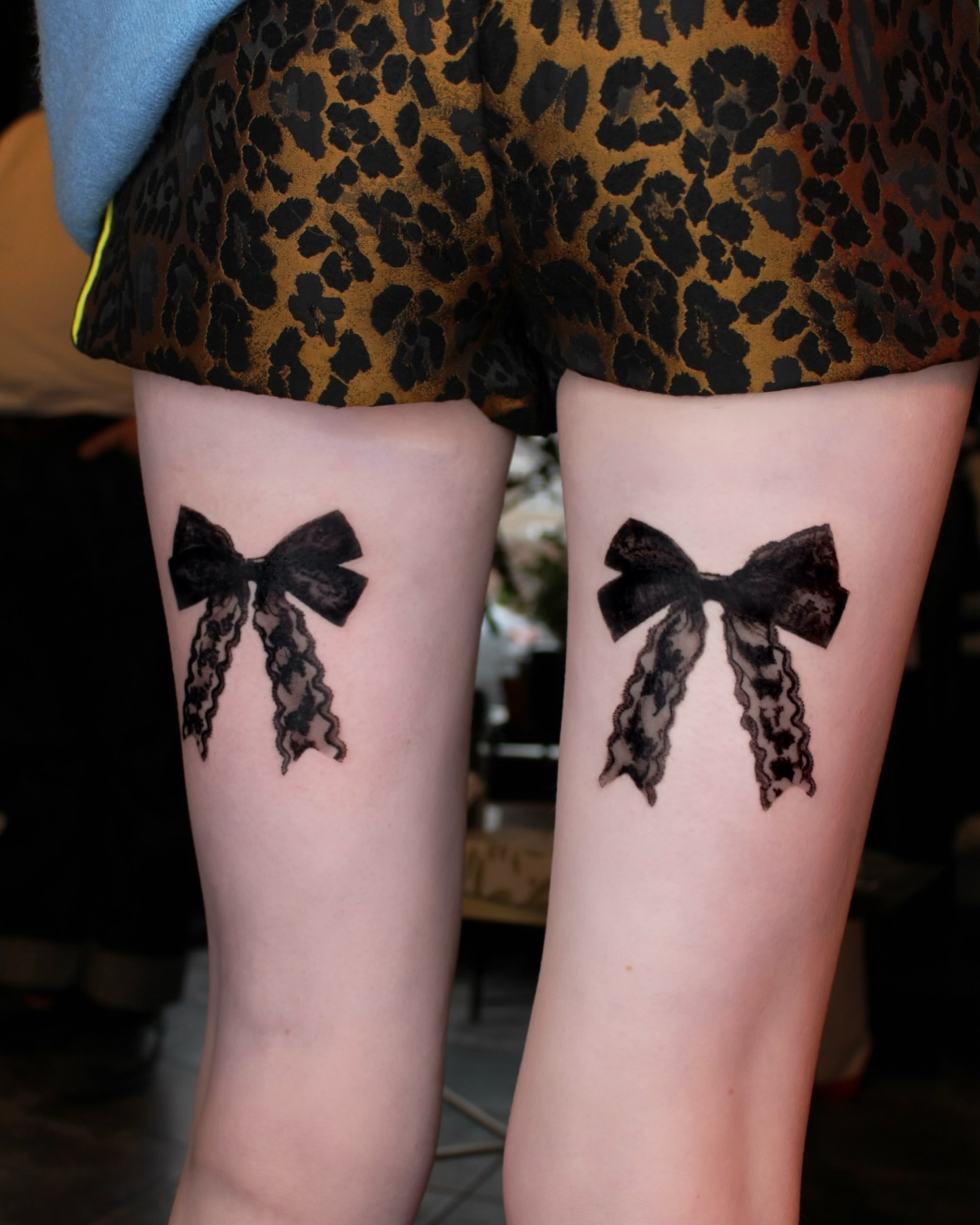Bow black and grey tattoo on the thigh by ππ²π§π§ ππ’π₯πππ« (π©π¦