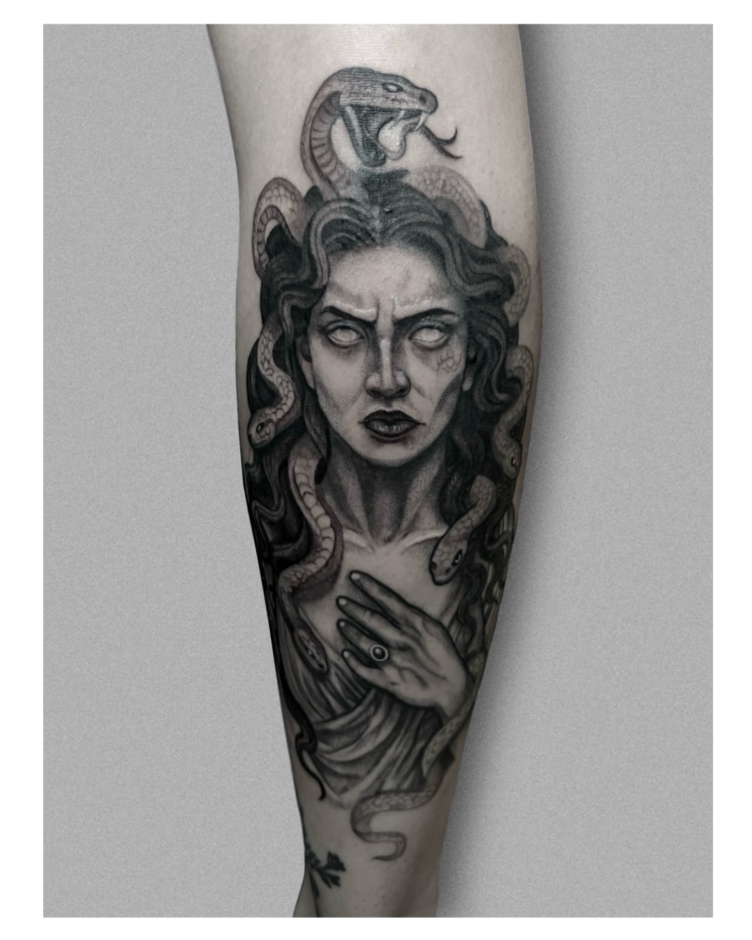 Medusa realism tattoo on the forearm by Jordyn Tinney