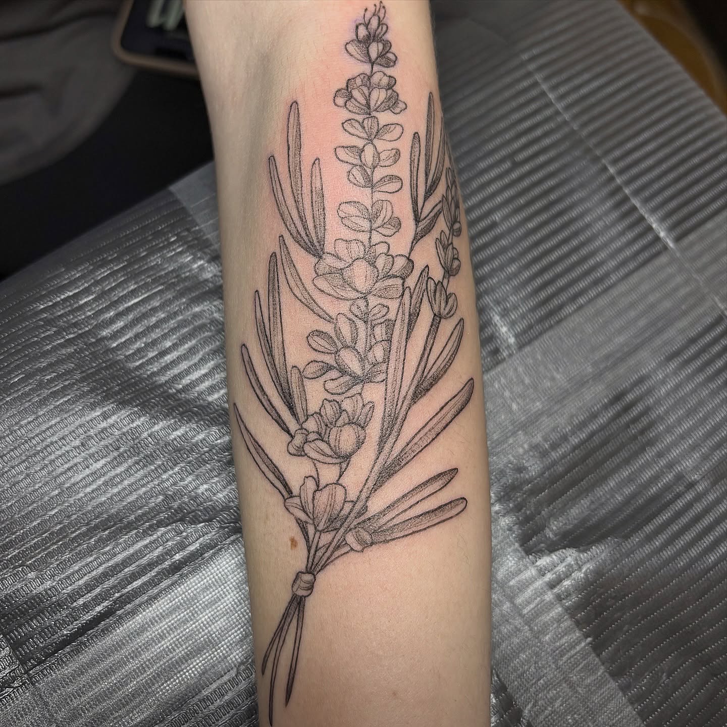 Lavender bouquet black and grey tattoo on the forearm by Sydney Gallucci