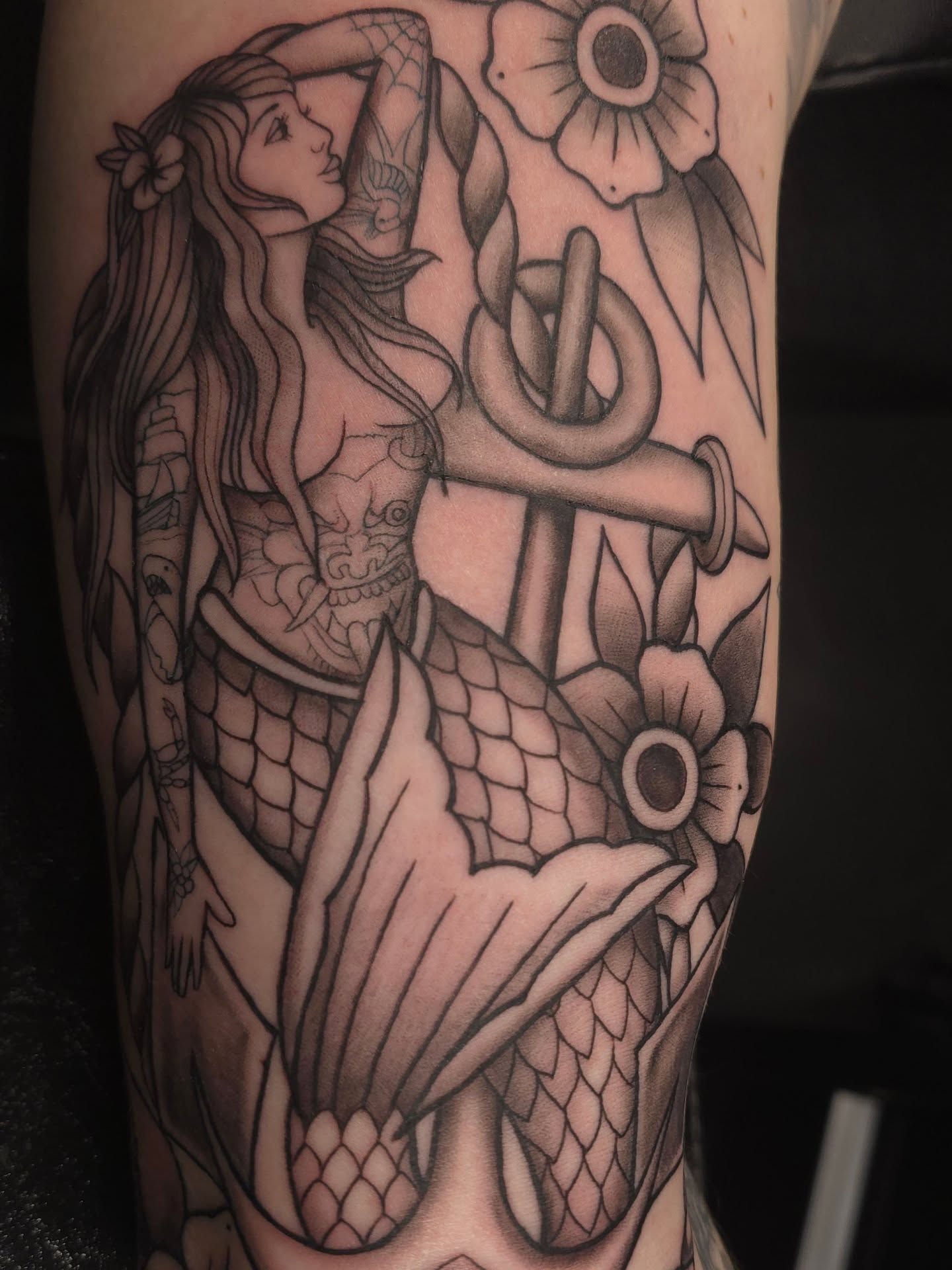 Mermaid black and grey tattoo on the forearm by Trinity