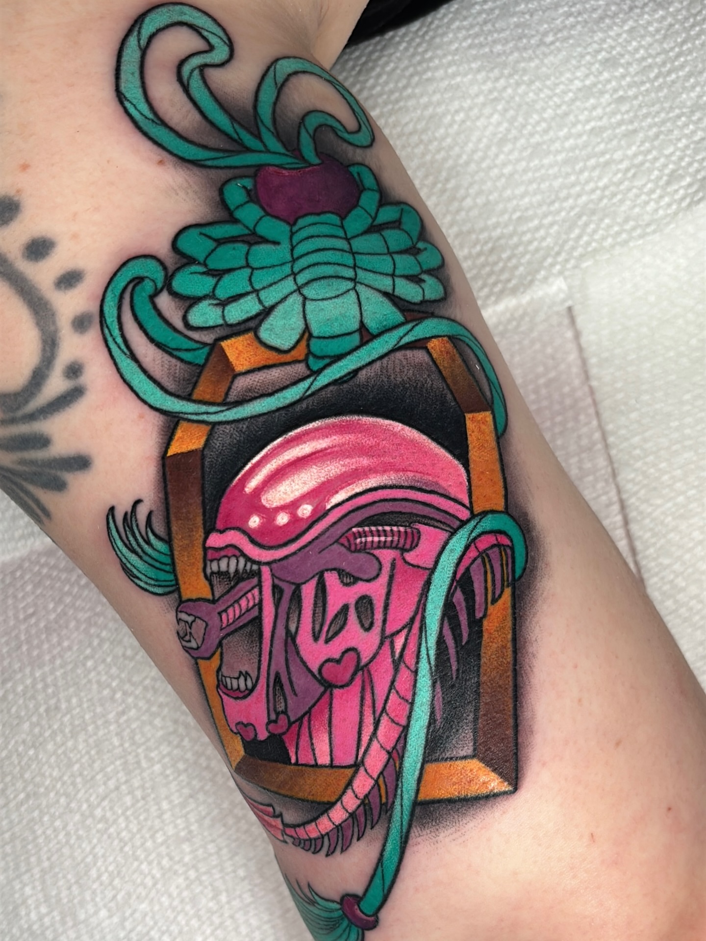Alien head American traditional tattoo on the forearm by Latesha Burnley