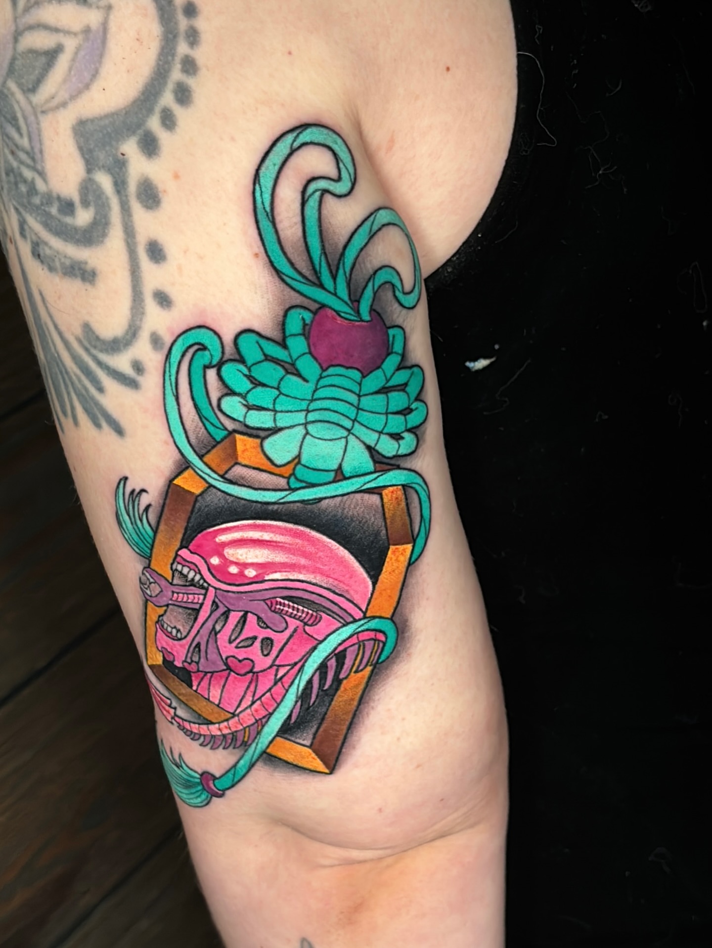 Alien helmet and succulent new school tattoo on the forearm by Latesha Burnley
