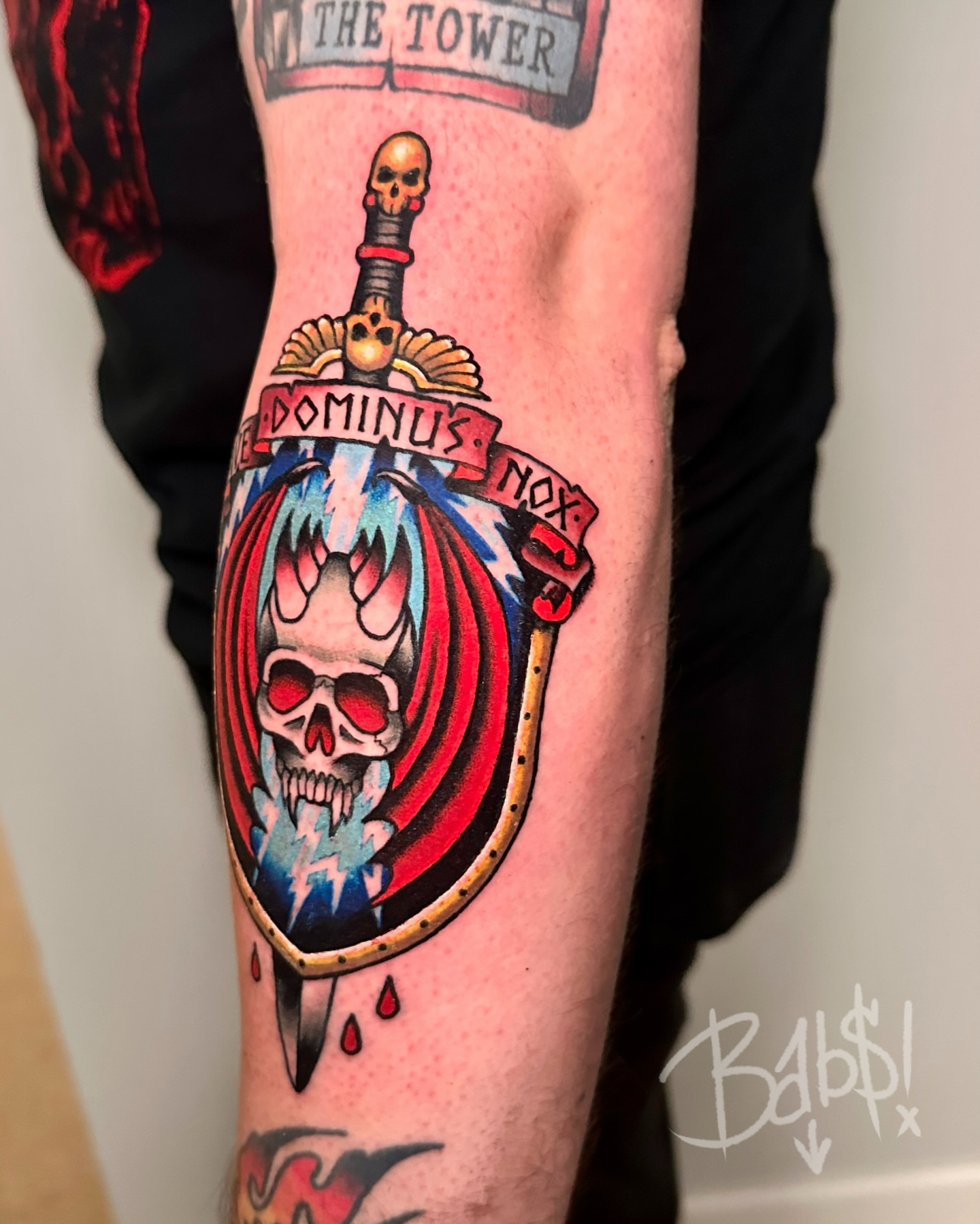 Skull and shield American traditional tattoo on the forearm by Justin B