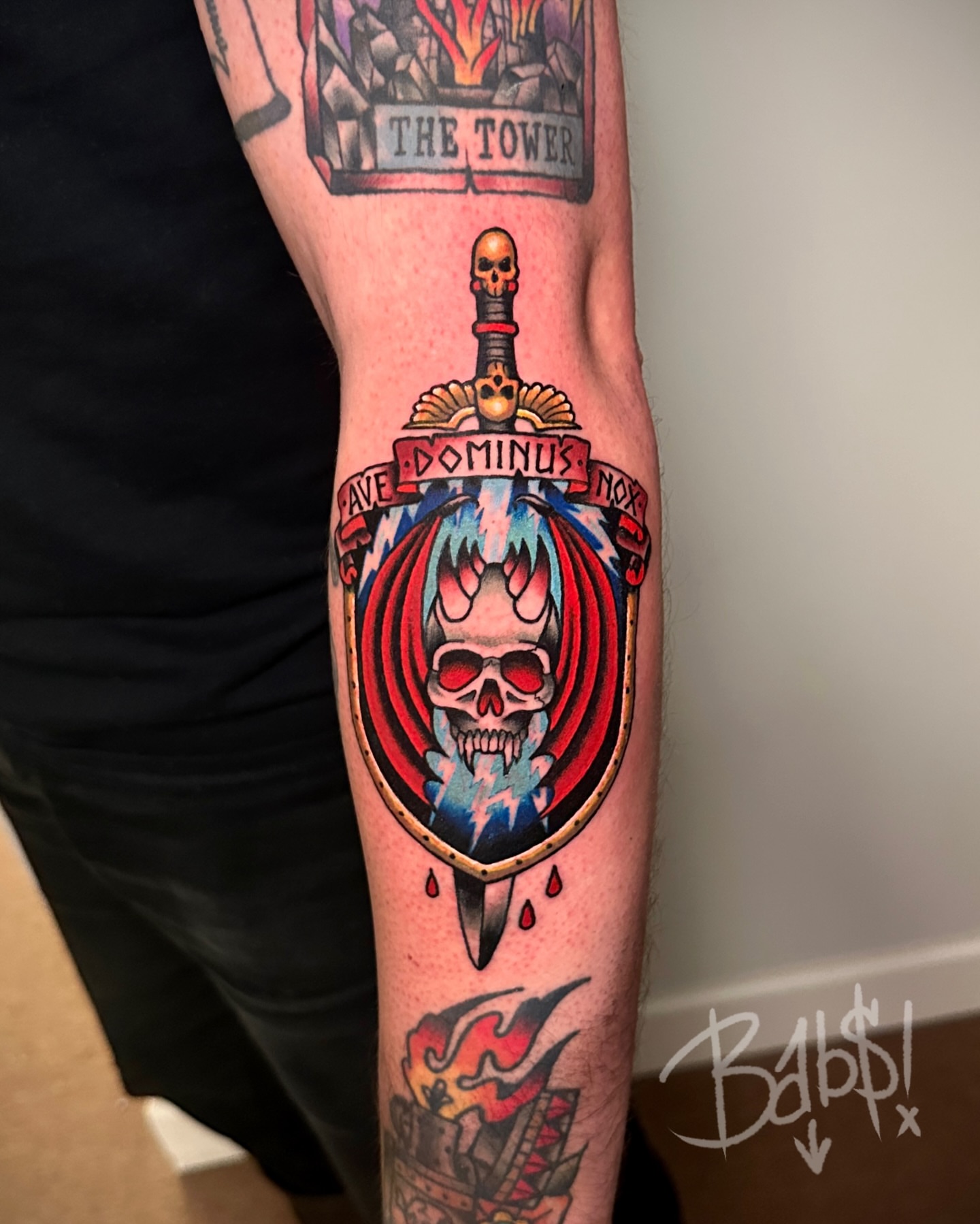 Skull and sword American traditional tattoo on the forearm by Justin B