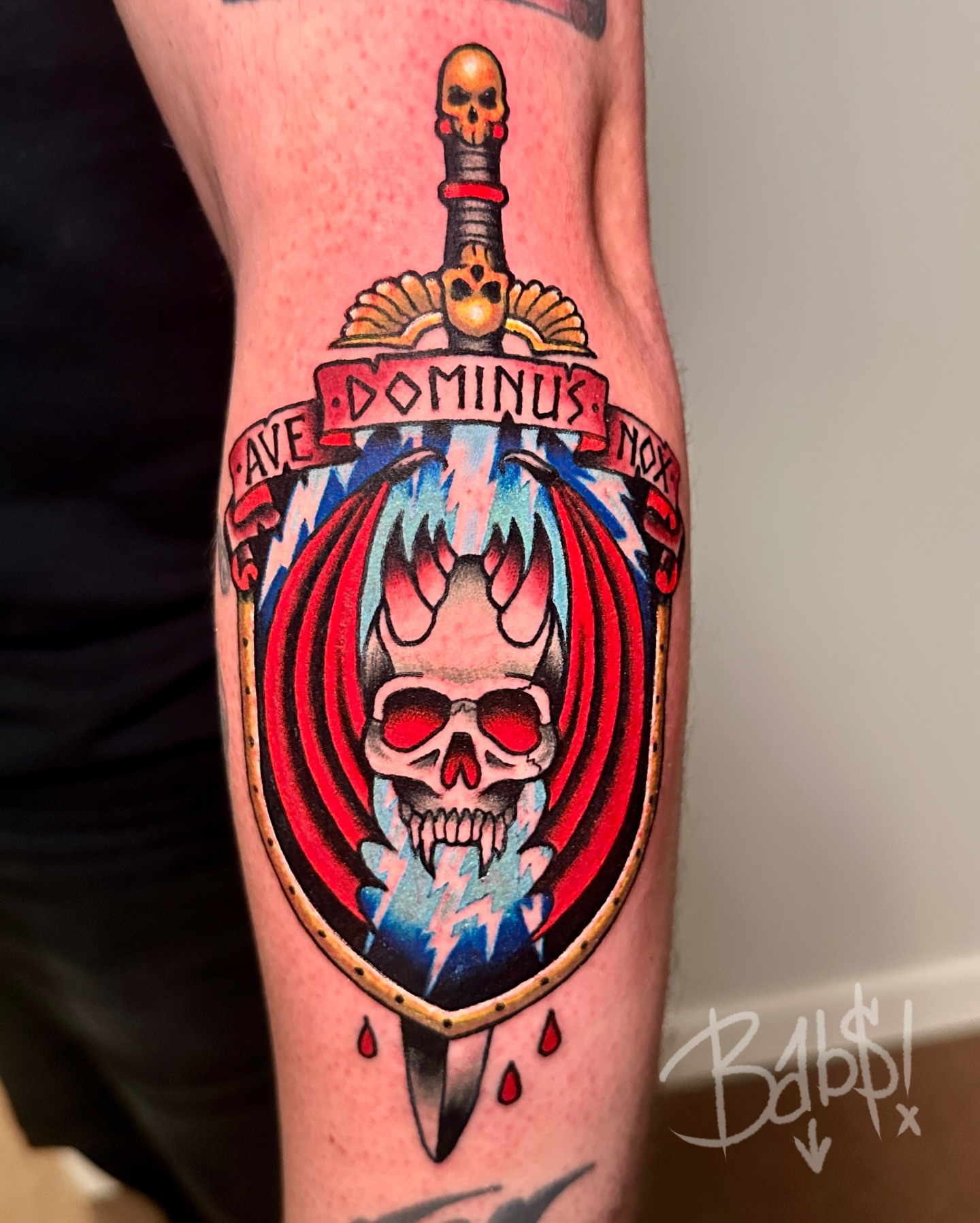 Flame skull shield American traditional tattoo on the forearm by Justin B