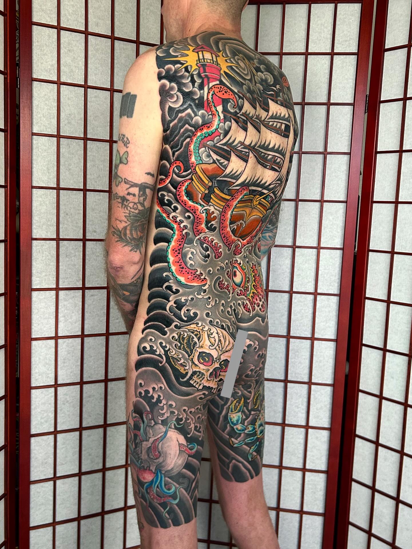 Dragon and ship japanese irezumi tattoo on the back by Adam Mir