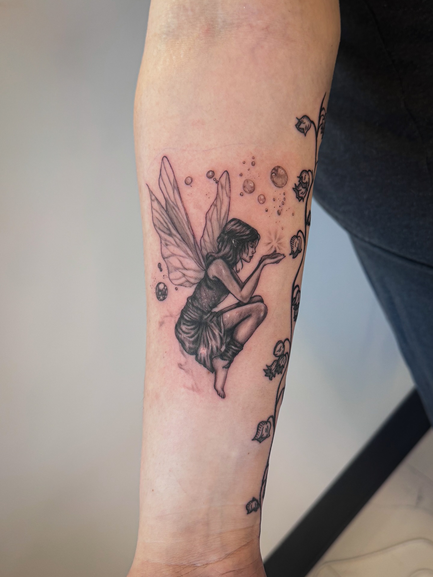 Fairy black and grey tattoo on the forearm by utah tattoo artist
