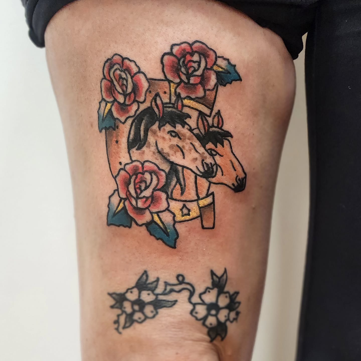 Horses and roses American traditional tattoo on the thigh by Sonya ๐ฟ๐ธ๐พ