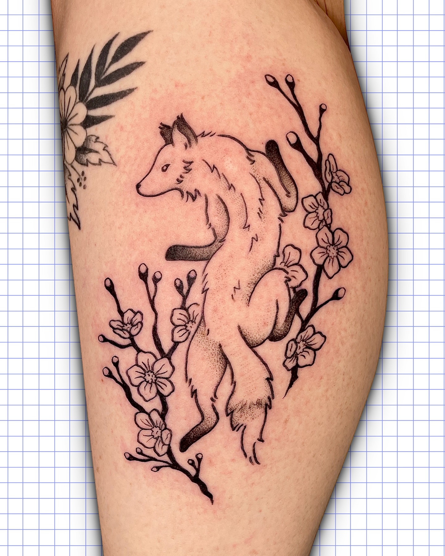 Fox and blossoms black and grey tattoo on the thigh by Sydney “Goose “ Lange