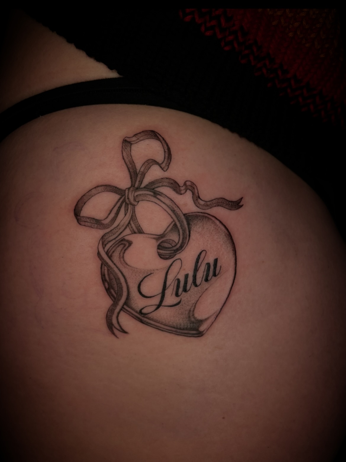 Heart with ribbon black and grey tattoo on the torso by Eryn, Portland, Oregon