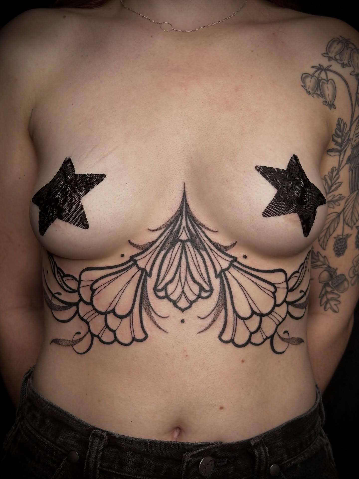 Lace-like pattern ornamental tattoo on the chest by Summer Shield