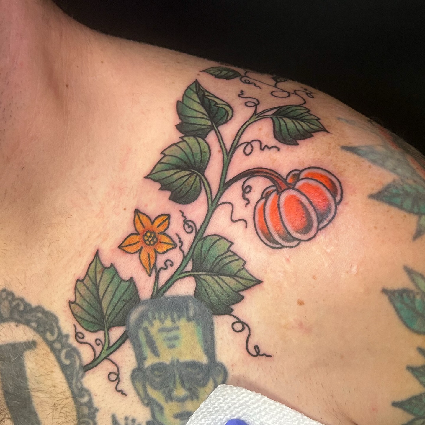 Pumpkin vine American traditional tattoo on the shoulder by Jessica Oram Brockman, Dayton, Ohio