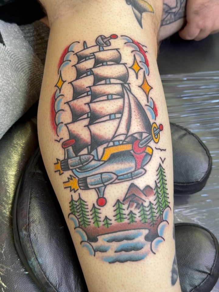 Ship and airplane American traditional tattoo on the forearm by Don Robison