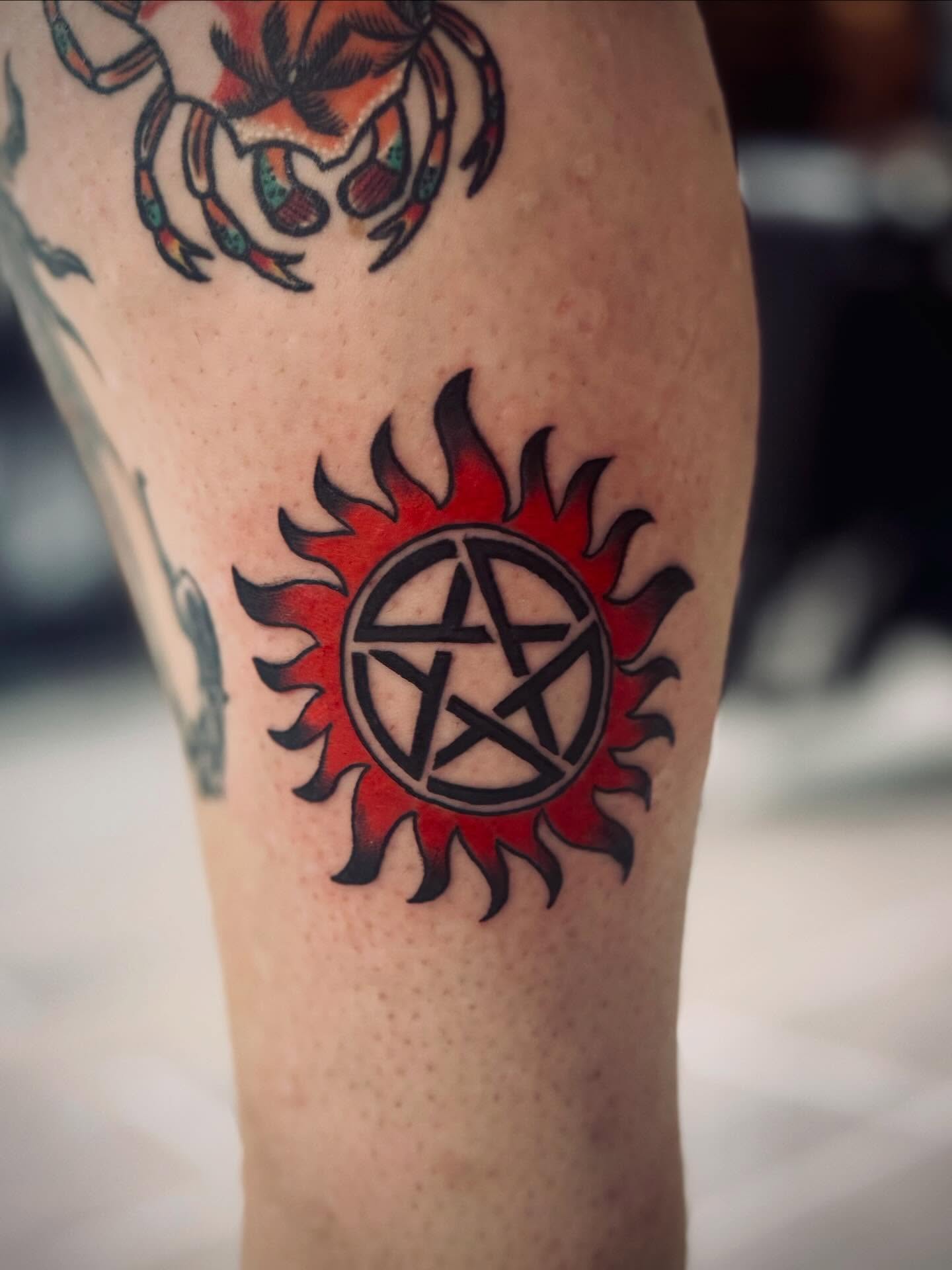 Anti-possession symbol American traditional tattoo on the forearm by Katelyn Arnold