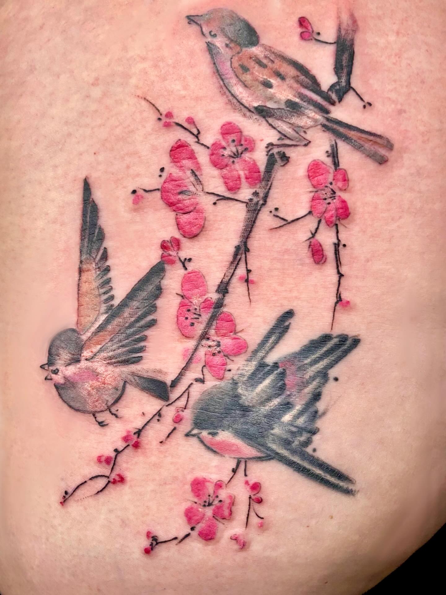 Birds and blossoms watercolor tattoo by julia seizure - tattooist