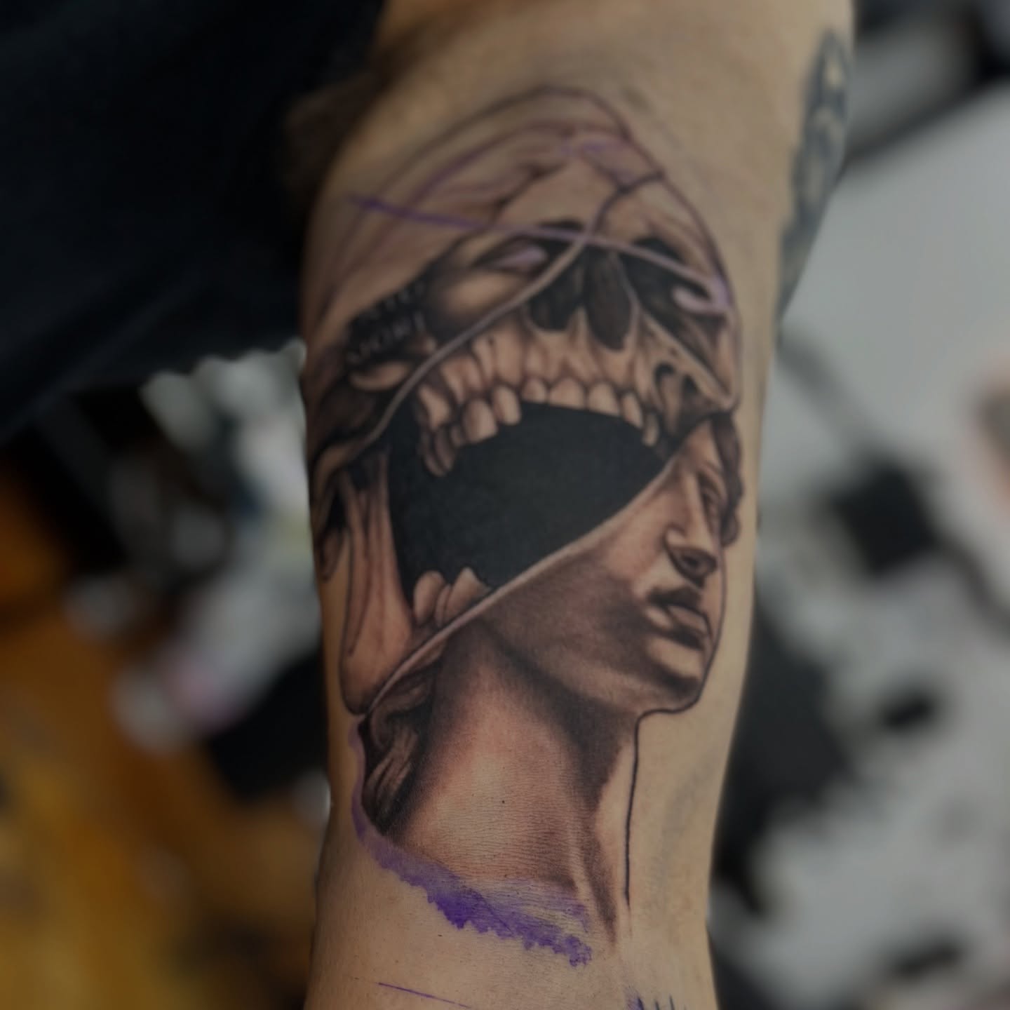 Blindfolded woman with skull realism tattoo on the forearm by Trent Hebert