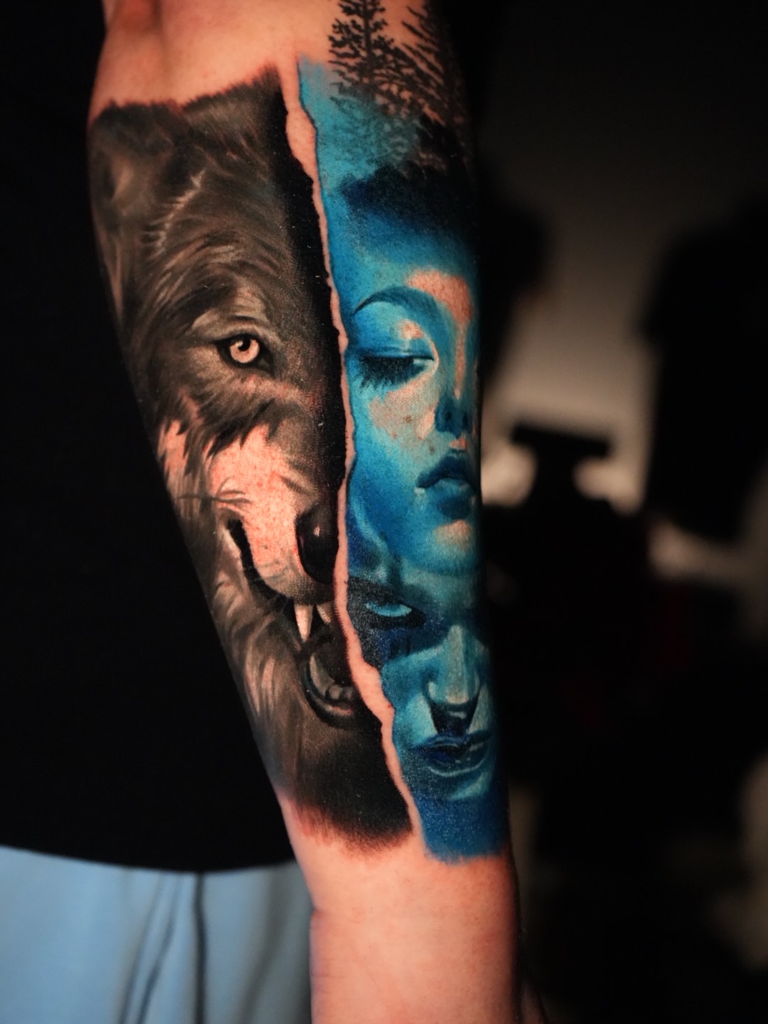 Wolf and woman realism tattoo on the forearm by Robert Morton, Cleveland, Ohio