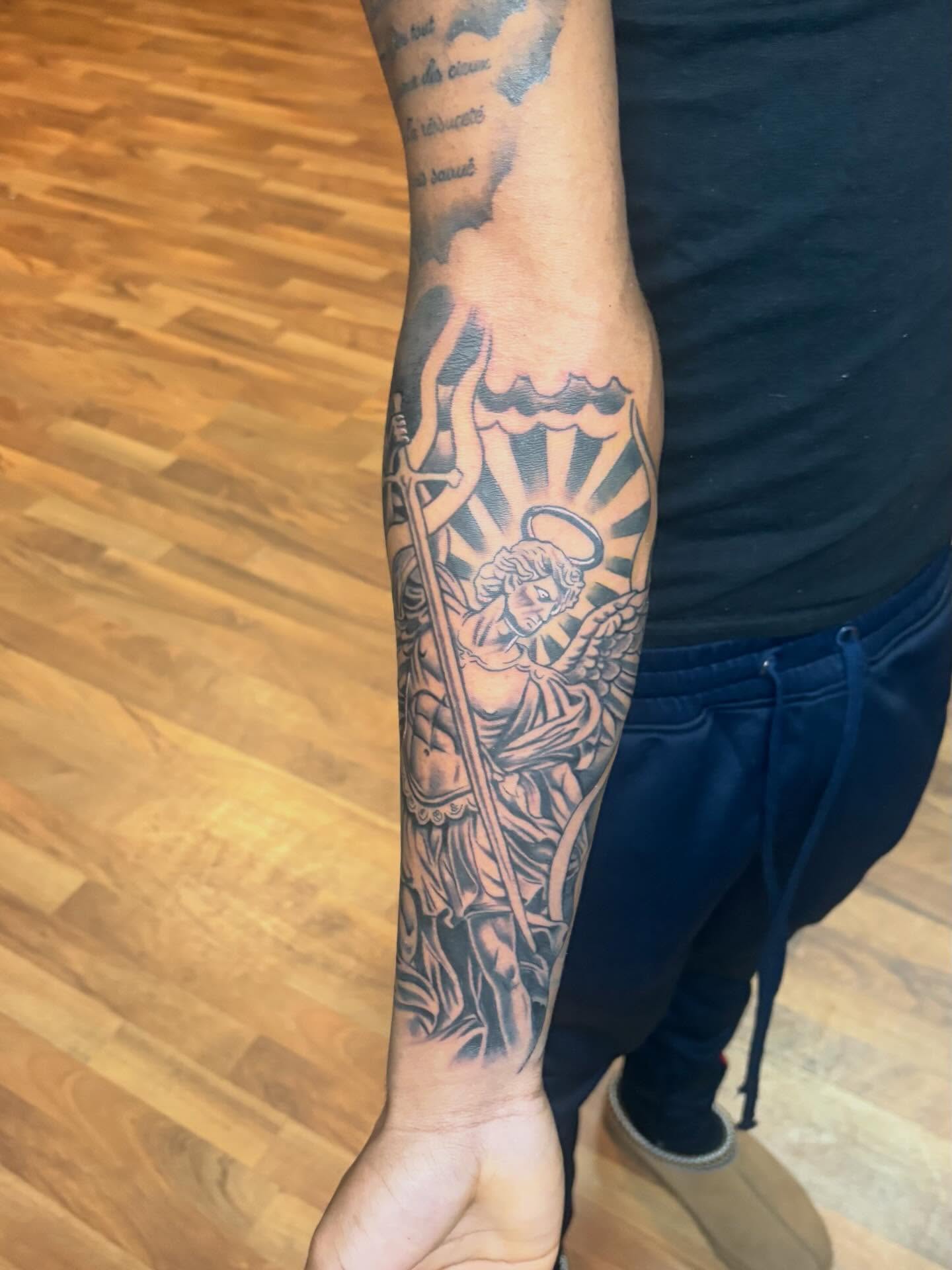 Angel with sword American traditional tattoo on the forearm by 𓂀 𝕊ℍ𝔼𝕃𝕃𝕐 𓂀
